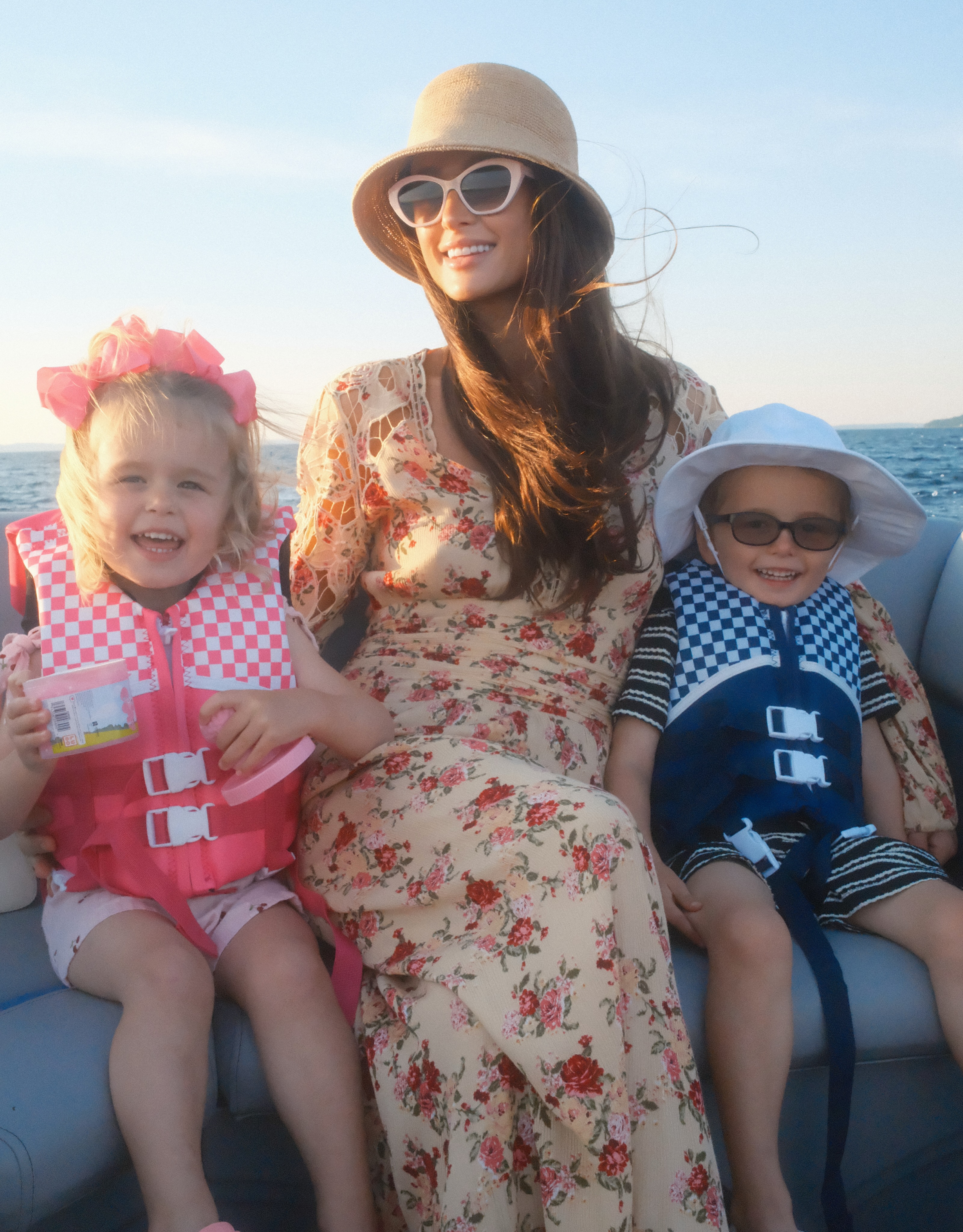 Phoenix and London wore contrasting life vests during the family's time on the water. The warm boating scenes reinforced Paris's message about cherishing laughter, smiles, and shared experiences with her children. | Source: Instagram/parishilton