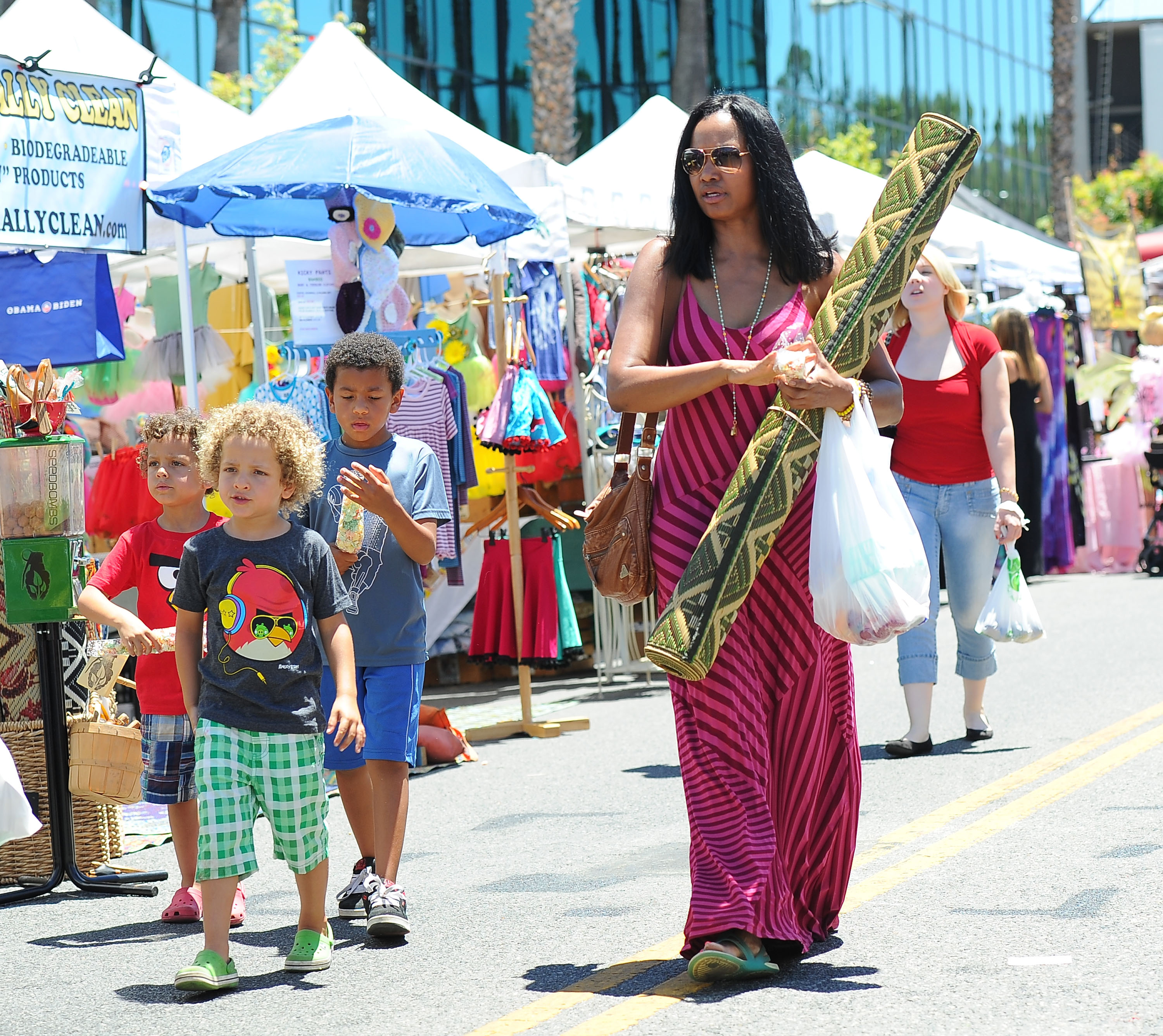 Garcelle Beauvais is spotted with her twin sons, Jaid Thomas and Jax Joseph Nilon, during a public outing at a Los Angeles street market on June 24, 2012 | Source: Getty Images