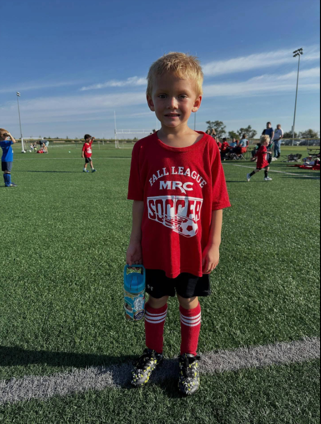 Six-year-old Adrian Cole is pictured in his soccer uniform on a field. Adrian, from McPherson, Kansas, was among the two people who died in the October 17 incident at Stryker Sports Complex in Wichita, prompting an outpouring of condolences from the community. | Source: Facebook/Onpoint Updates