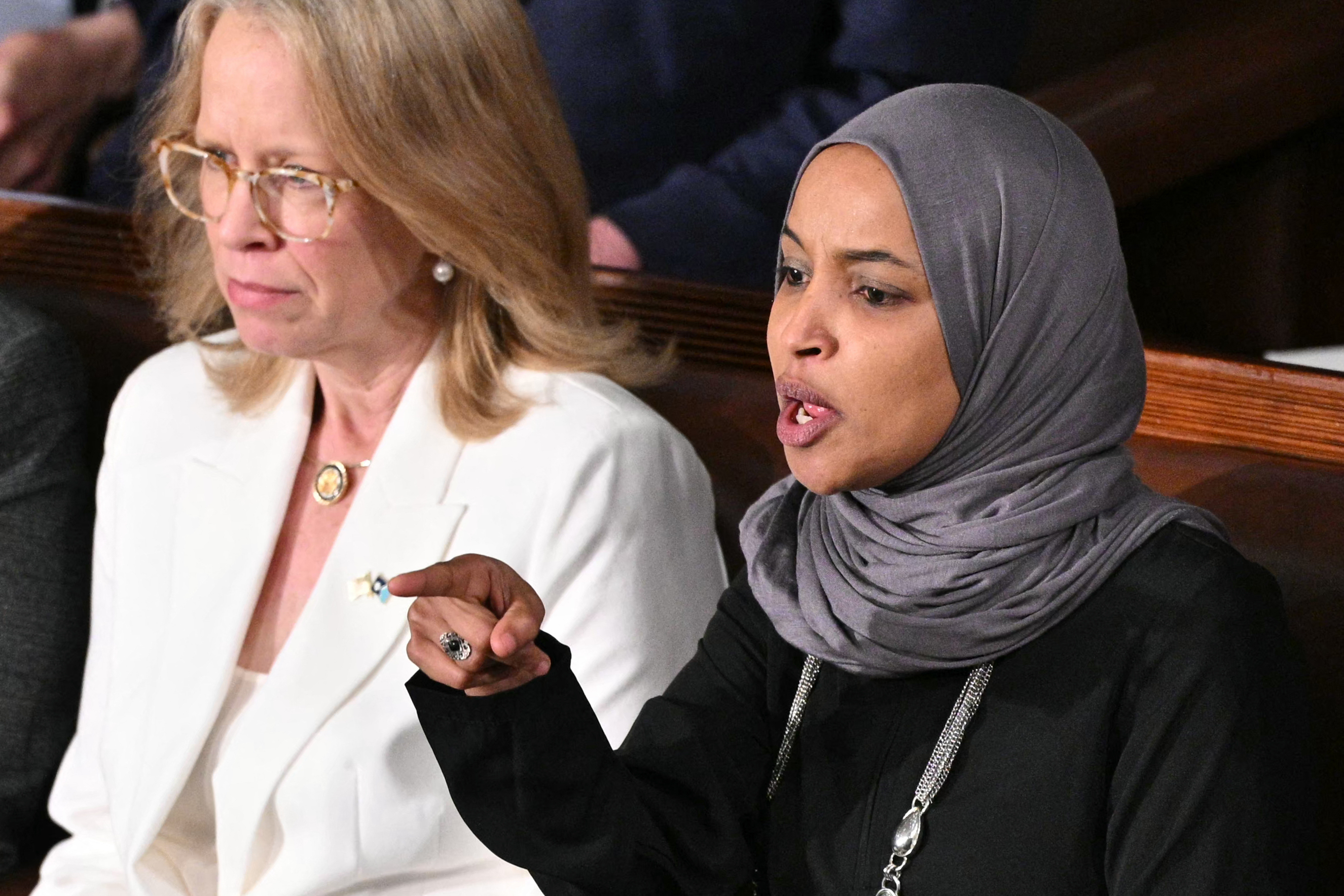 Representative Ilhan Omar, Democrat from Minnesota, reacts as US President Donald Trump delivers the State of the Union address in the House Chamber of the US Capitol in Washington, DC, on February 24, 2026. | Source: Getty Images