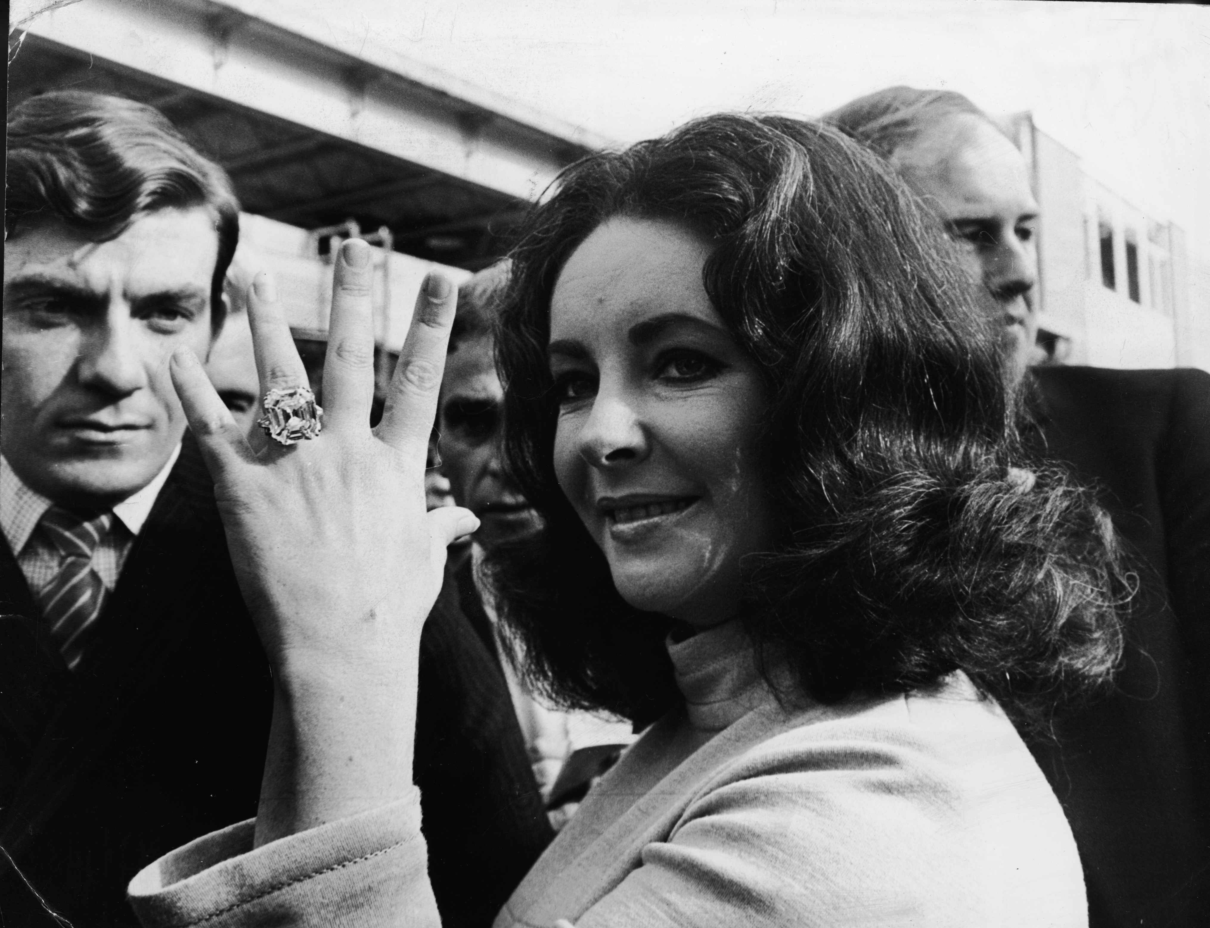 Elizabeth Taylor displays the 33.19-carat diamond ring given to her by husband Richard Burton. The gem is valued between $2.5 million and $3.5 million.