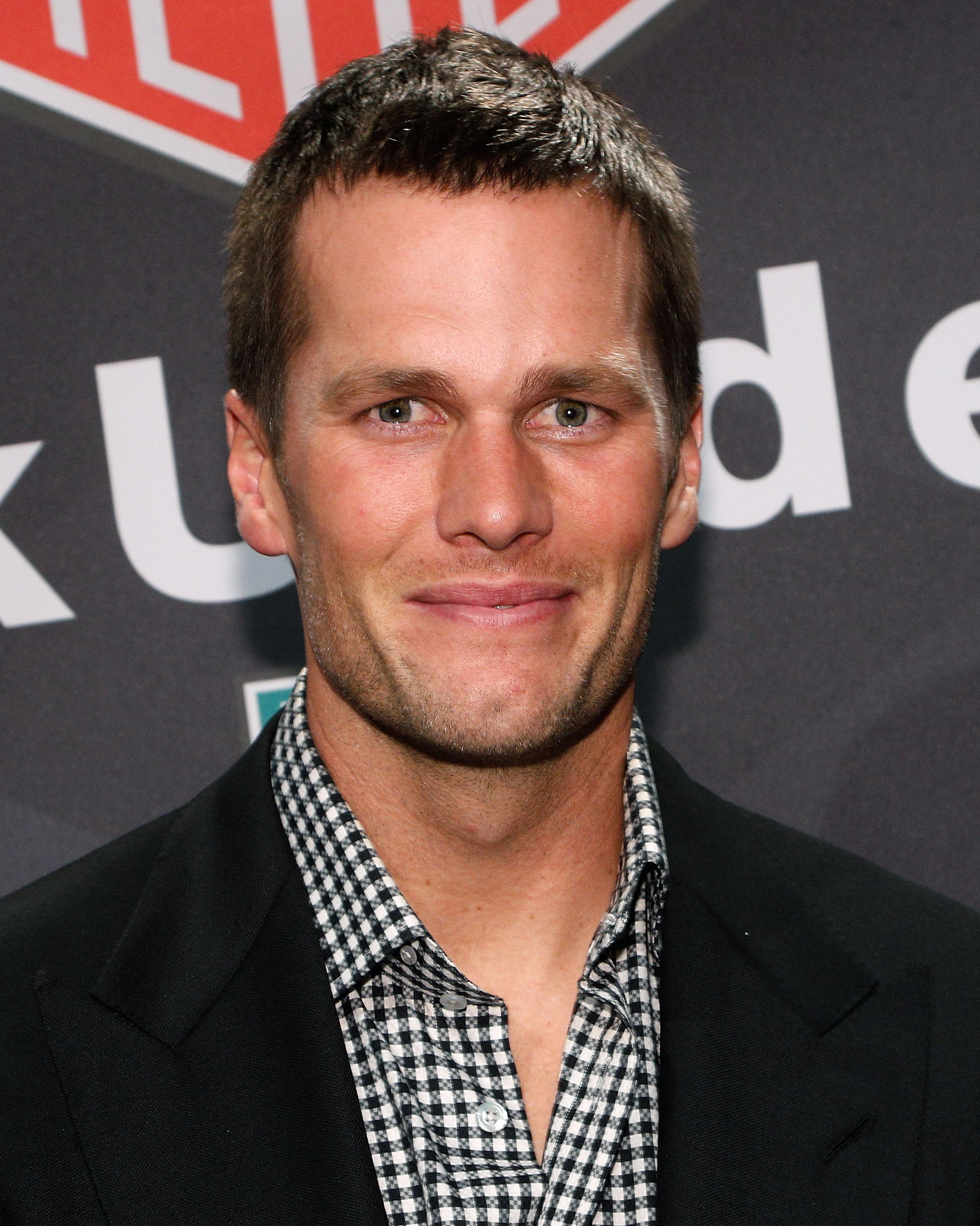 Tom Brady attended a Muhammad Ali tribute event in Brooklyn in 2016, wearing a tailored blazer and a closely cropped hairstyle.