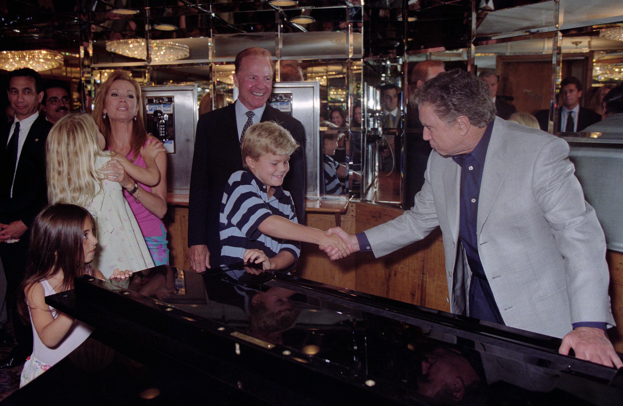 This family photograph from 2000 shows Kathie Lee and Frank with their children, Cody and Cassidy, who were still in school at the time. | Source: Getty Images.