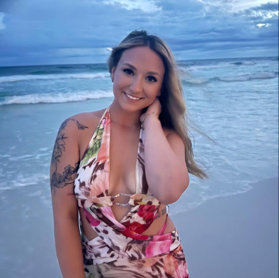 Katie McCormack smiles by the ocean in a photo shared on social media. Her name has surfaced in friends’ accounts of Nolan Wells’ final known interactions before he disappeared. | Source: Facebook/Katie McCormack
