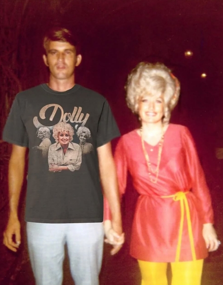 Holding hands and smiling for the camera, Dean and Parton offered a colorful snapshot of their life together away from the stage. Parton wore a bright red belted top with yellow pants, while Dean kept his look casual beside her. The relaxed photograph reflected the private relationship they maintained as Parton's fame grew, with Dean choosing a quieter existence rather than joining his wife in the celebrity spotlight. | Source: Facebook/One Country