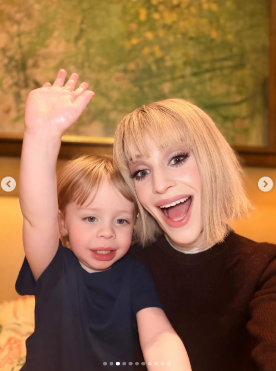 One photo shows Kelly smiling for a selfie with Sidney during an Easter outing. Sidney raises one hand toward the camera as he sits close beside his mother. | Source: Instagram/kellyosbourne