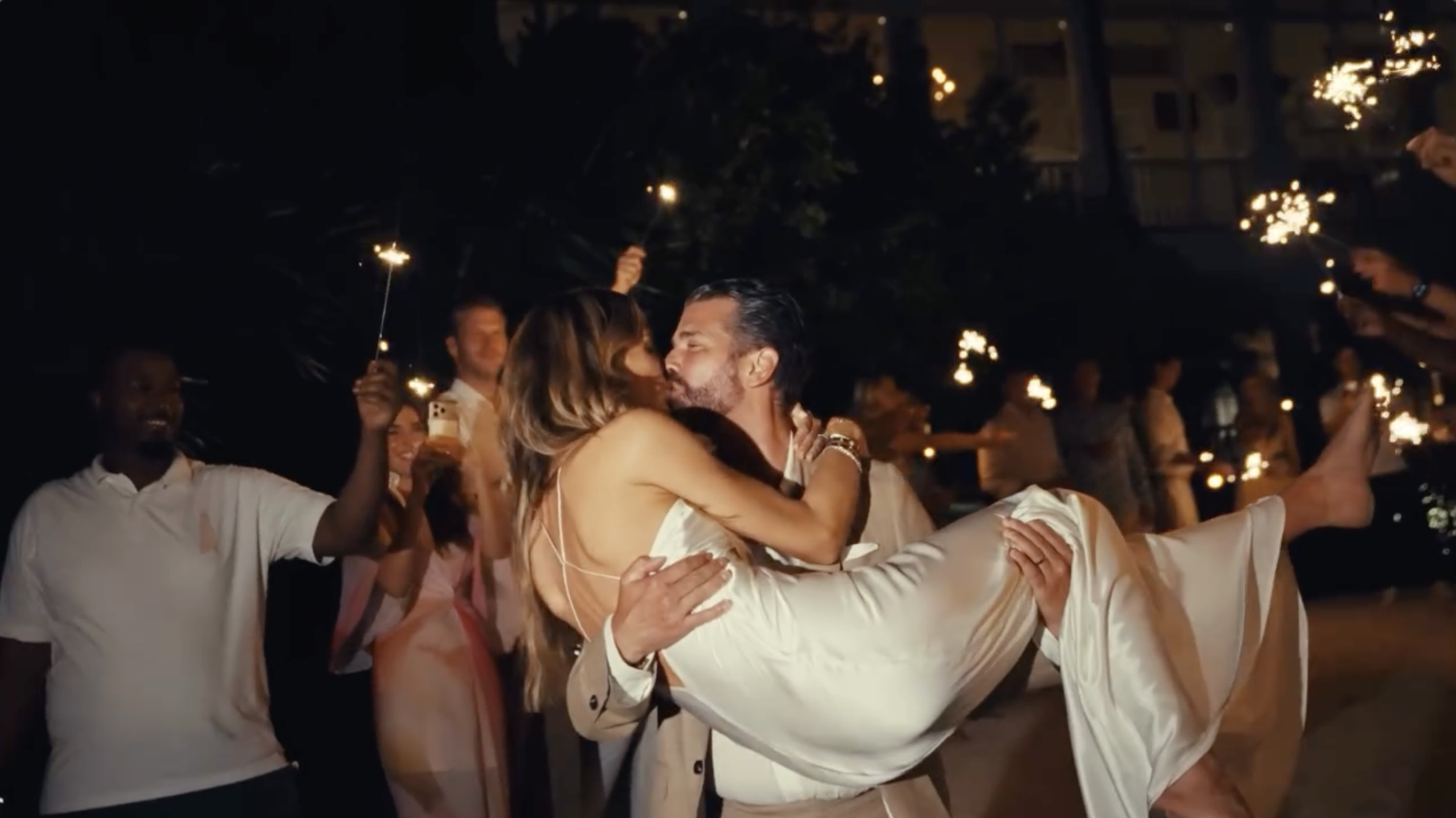 Donald Trump Jr. and Bettina Anderson share a kiss while surrounded by sparklers at the close of their wedding festivities. | Source: Instagram/donaldjtrumpjr