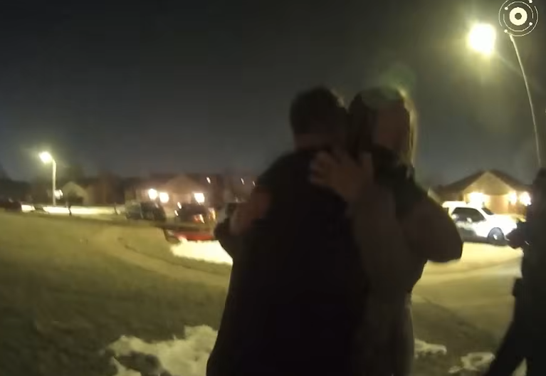 Bodycam footage showing Caleb Flynn hugging the grandmother of his children while both sobbed, dated March 2, 2026 | Source: YouTube/Law&Crime Network