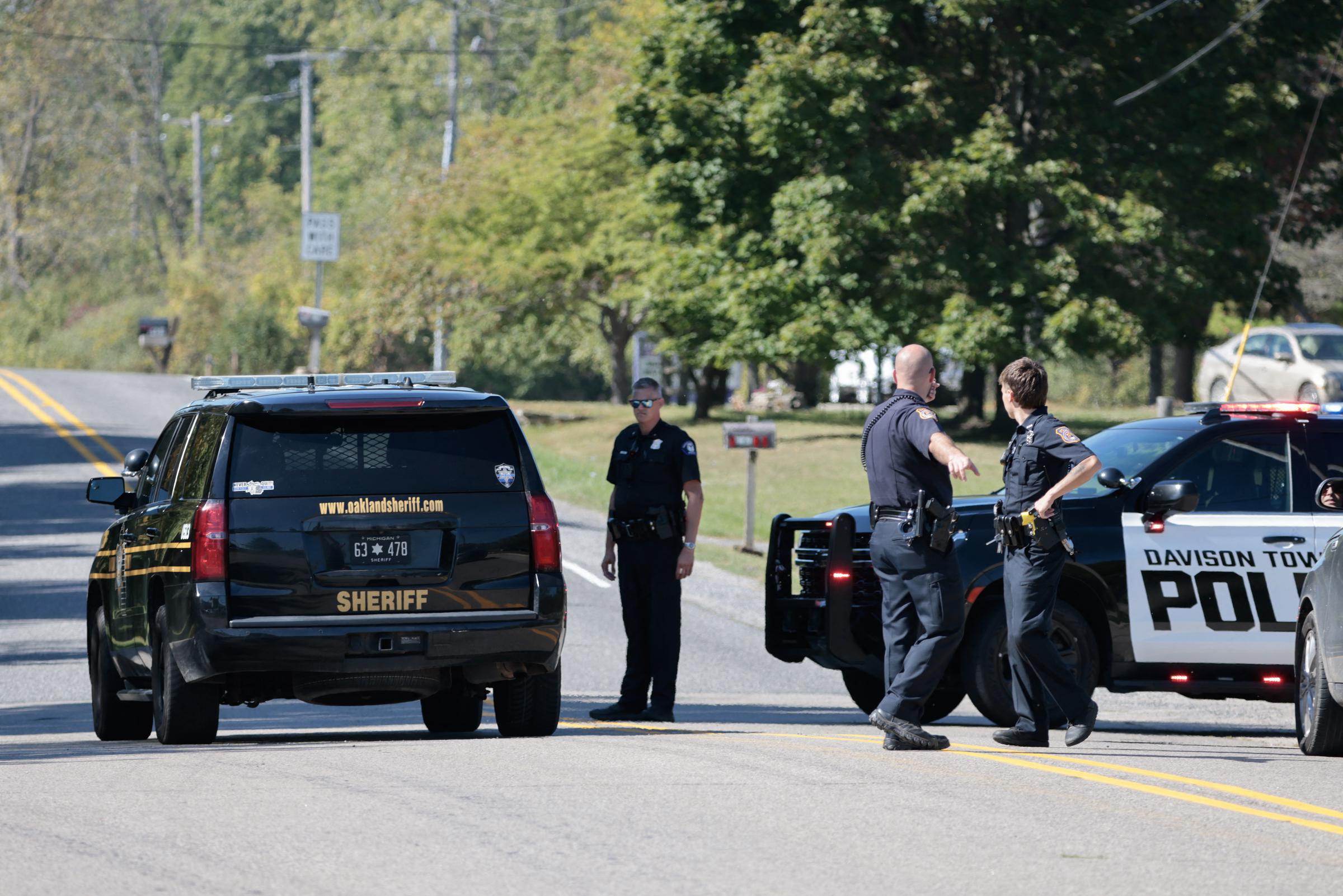 Police block a road near the scene of a shooting at a church in Grand Blanc, Michigan, on September 28, 2025. | Source: Getty Images