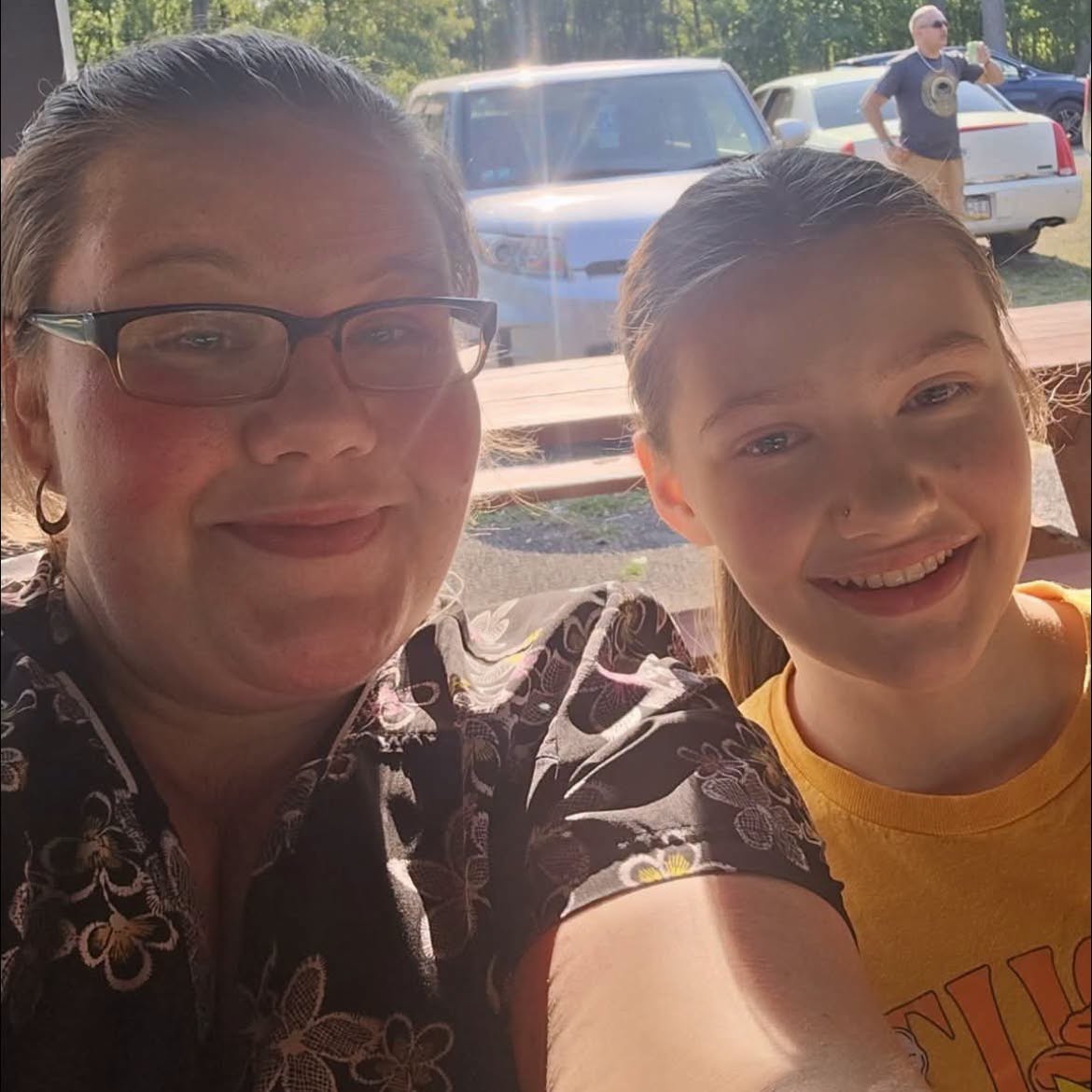 Lora Roberts, 37, shares a tender moment with a young girl in a smiling selfie. The mother of five was among nine victims killed in the horrific Erie, Pennsylvania, shooting on October 9. | Source: Facebook/MattThibodeau