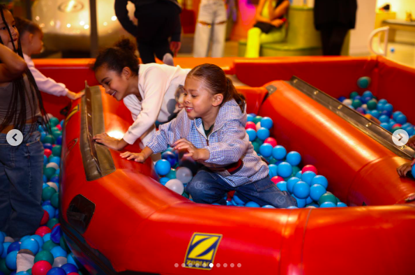 Aeko Brown playing in a ball pit with a loved one. | Source: Instagram/ammikaaa