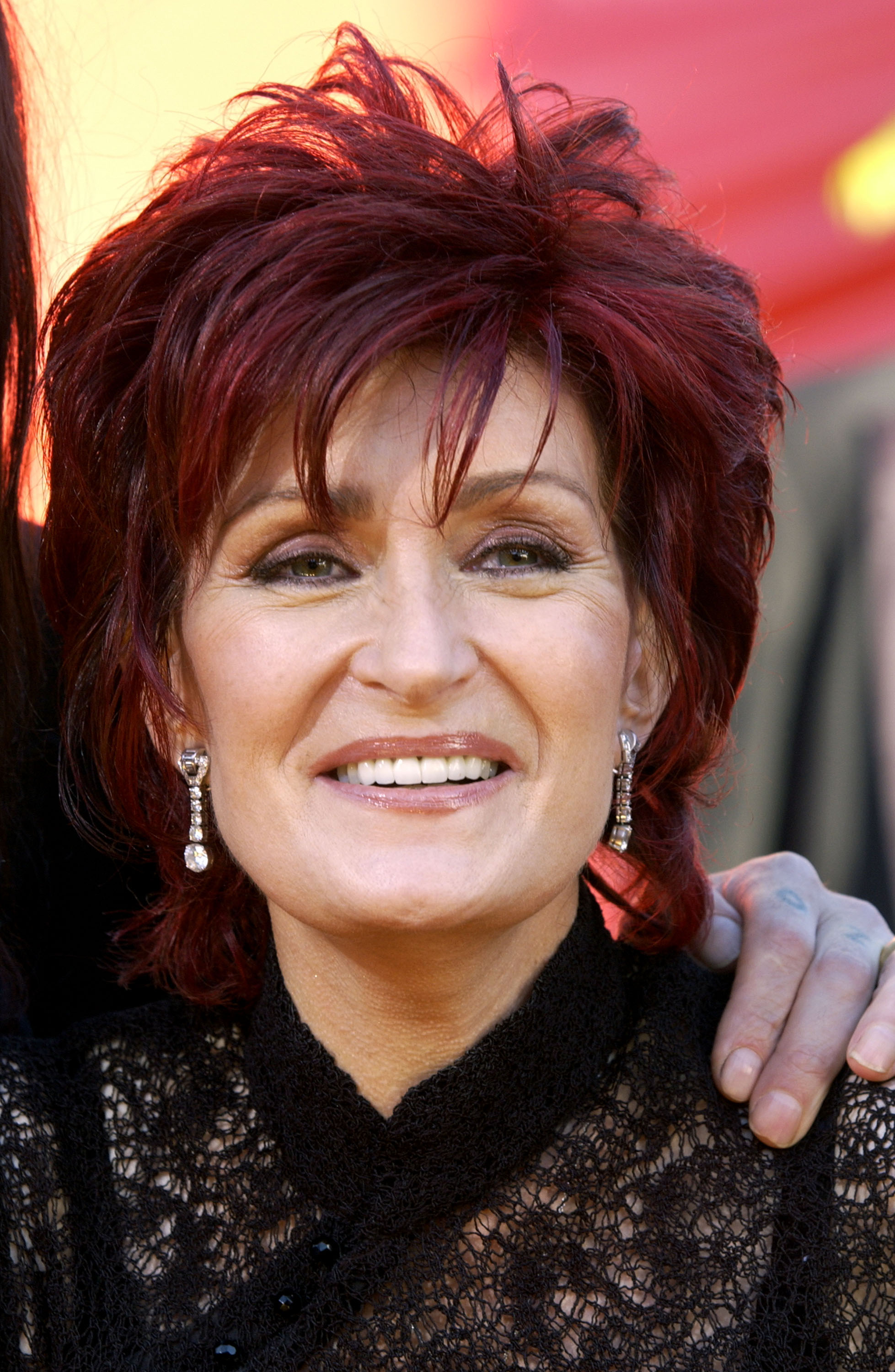 Sharon Osbourne at 49 years old. [Photo taken in September 2002]. | Fun Fact: Sharon's career reached a new level when MTV premiered "The Osbournes" in March 2002, introducing millions of viewers to her family's unconventional home life. The series became a major ratings success, and Sharon earned a Primetime Emmy Award as one of its producers when the show won Outstanding Non-Fiction Program (Reality) in 2002, according to the Television Academy.