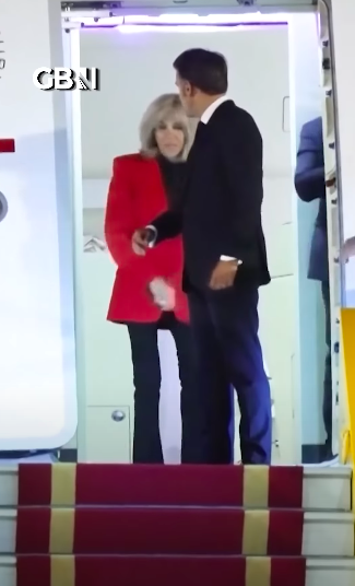 Emmanuel Macron offering his arm to Brigitte Macron. | Source: YouTube/GBNews