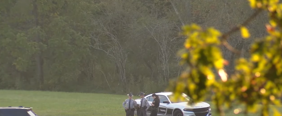 Local police officers at the sight of the plane crash, from a report posted on October 16, 2025 | Source: Youtube/FOX Carolina News