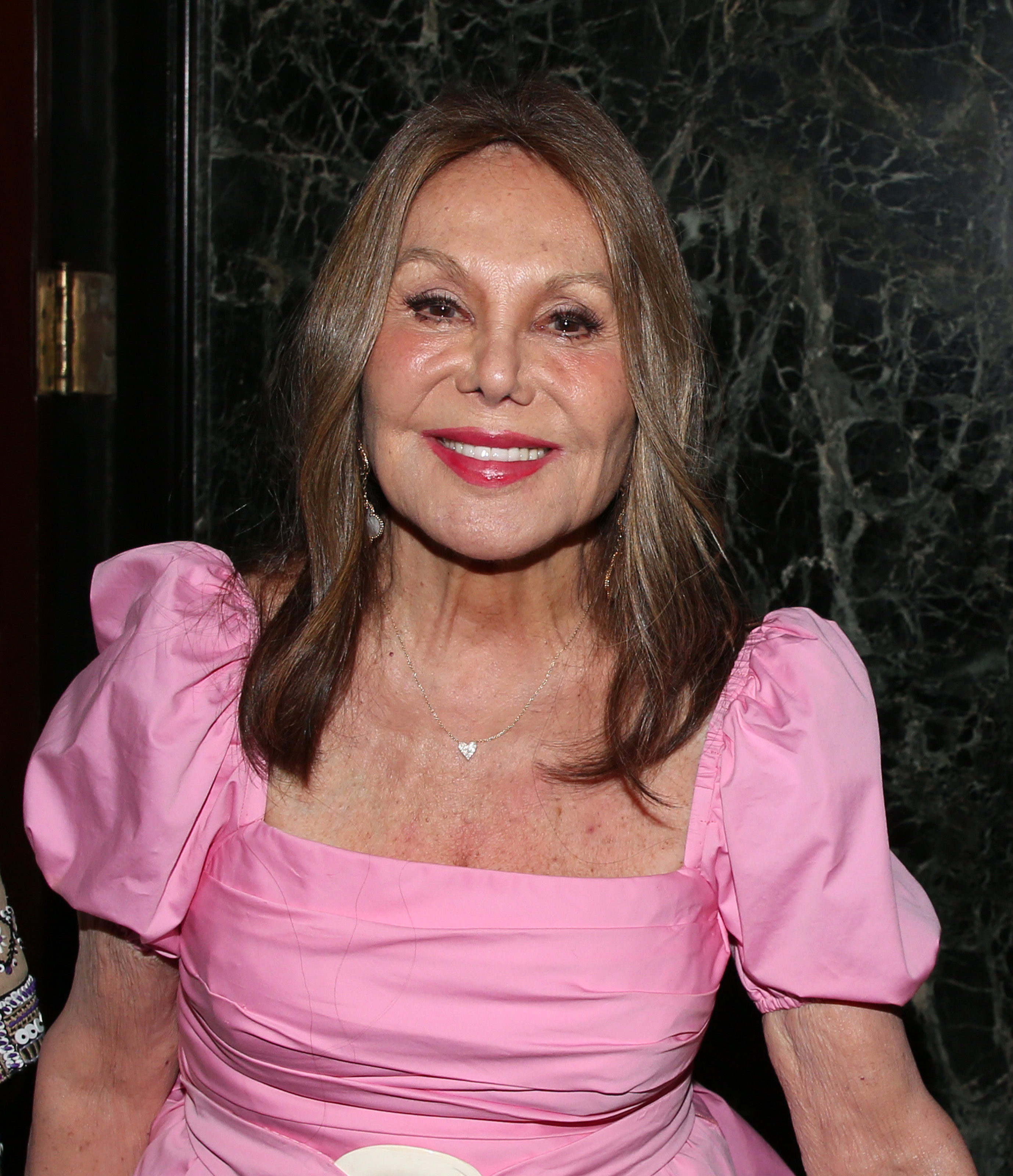 Marlo Thomas attends the Broadway opening of "Every Brilliant Thing," smiling for photographers in a pink puff-sleeve dress and heart-shaped pendant necklace. | Source: Getty Images