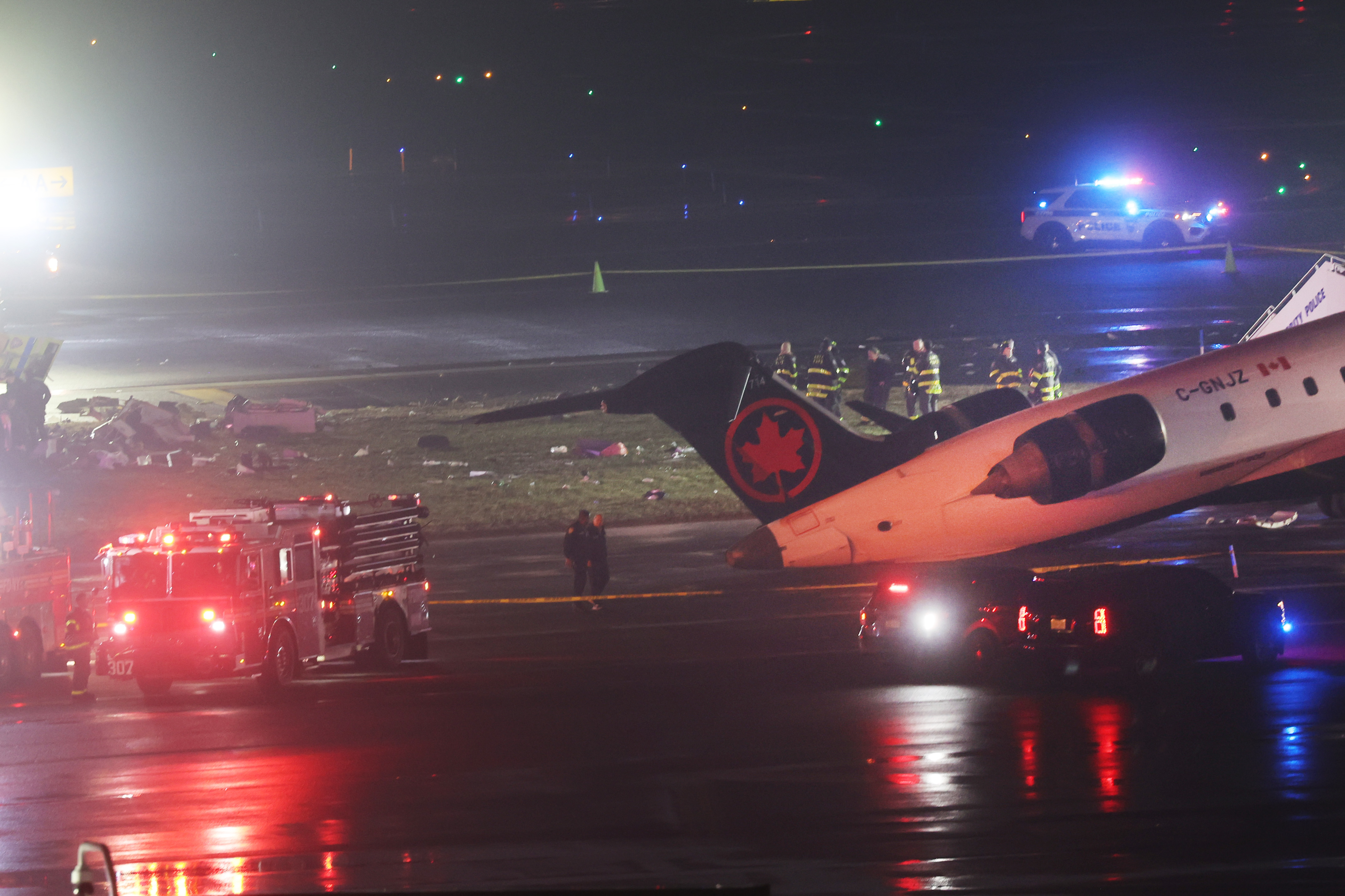 An Air Canada Express CRJ-900 sits on the runway after colliding with a Port Authority fire truck at LaGuardia Airport on March 23, 2026, in New York City | Source: Getty Images