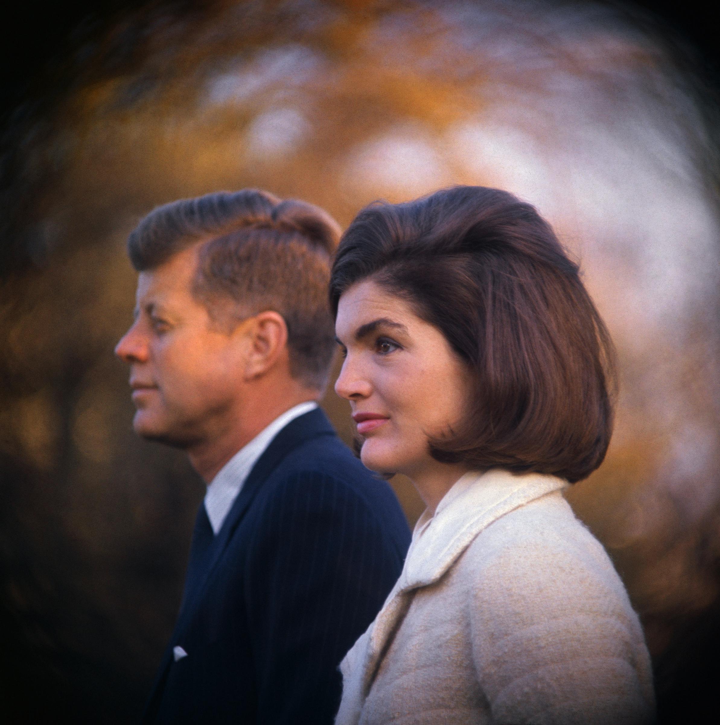 John F. Kennedy and Jacqueline Kennedy Onassis on the White House lawn as they witnessed part of the performance of the Black Watch Royal Highland Regiment in 1963. | Source: Getty Images