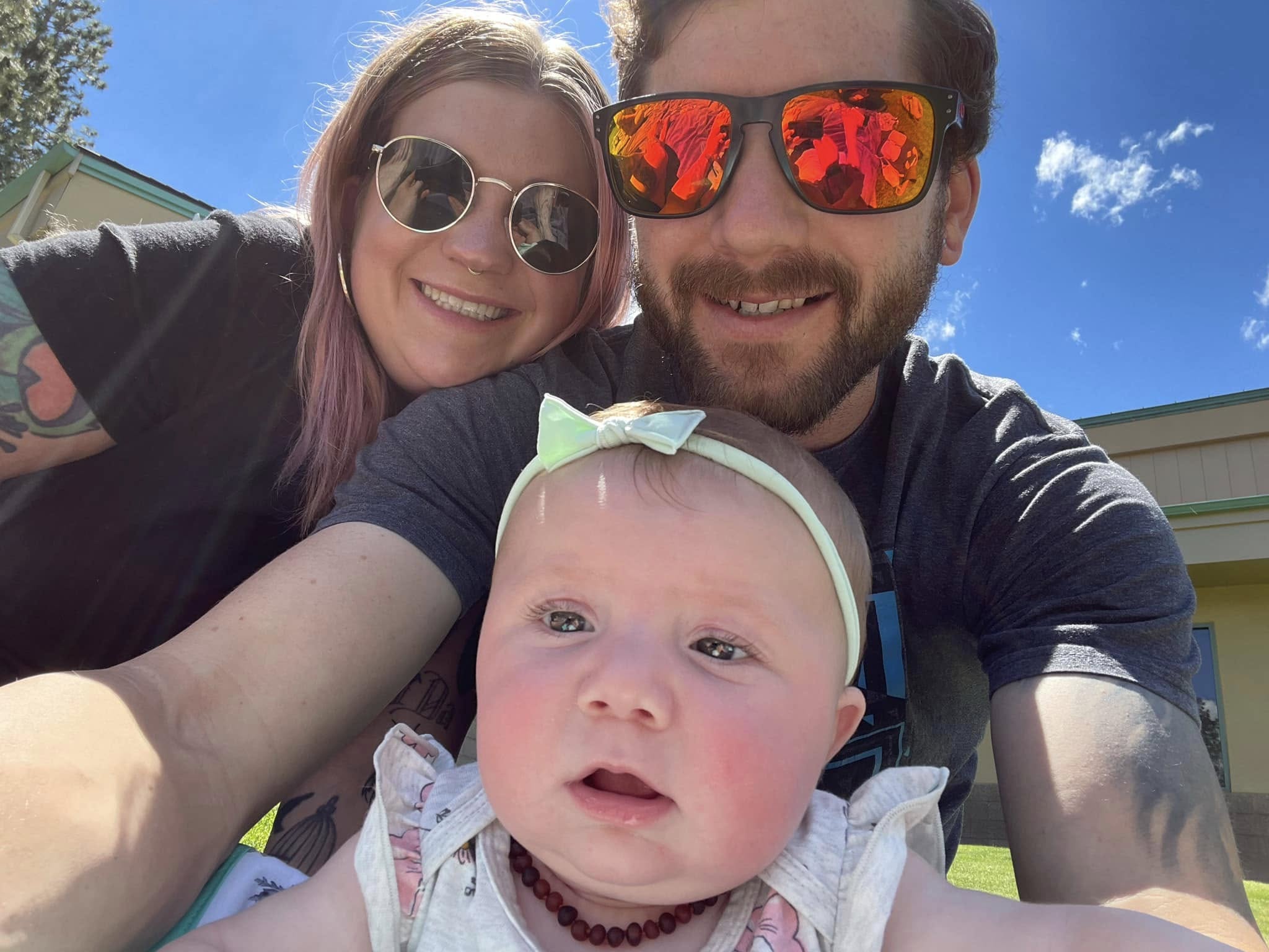 Kaylub Giamanco smiles alongside his wife, Kelsey, and their young child in a sunny family selfie. A longtime resident of the Bend area, Giamanco built his life around his home and family, deeply dedicated to protecting the people he loved most. Those close to him frequently speak of his generous heart and devotion as a father, qualities that defined his character long before danger ever approached his children's school. | Source: Facebook/Kaylub Giamanco