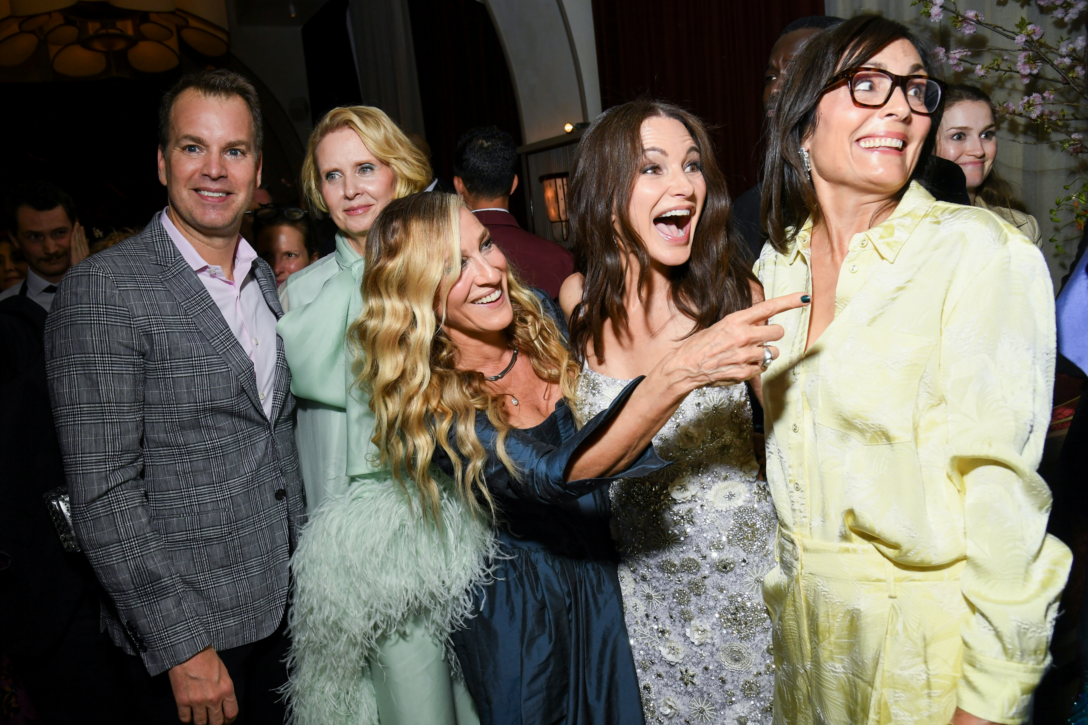 Casey Bloys, Cynthia Nixon, Sarah Jessica Parker, Kristin Davis, and Sarah Aubrey are seen sharing a lively moment during the "And Just Like That..." photo call event.