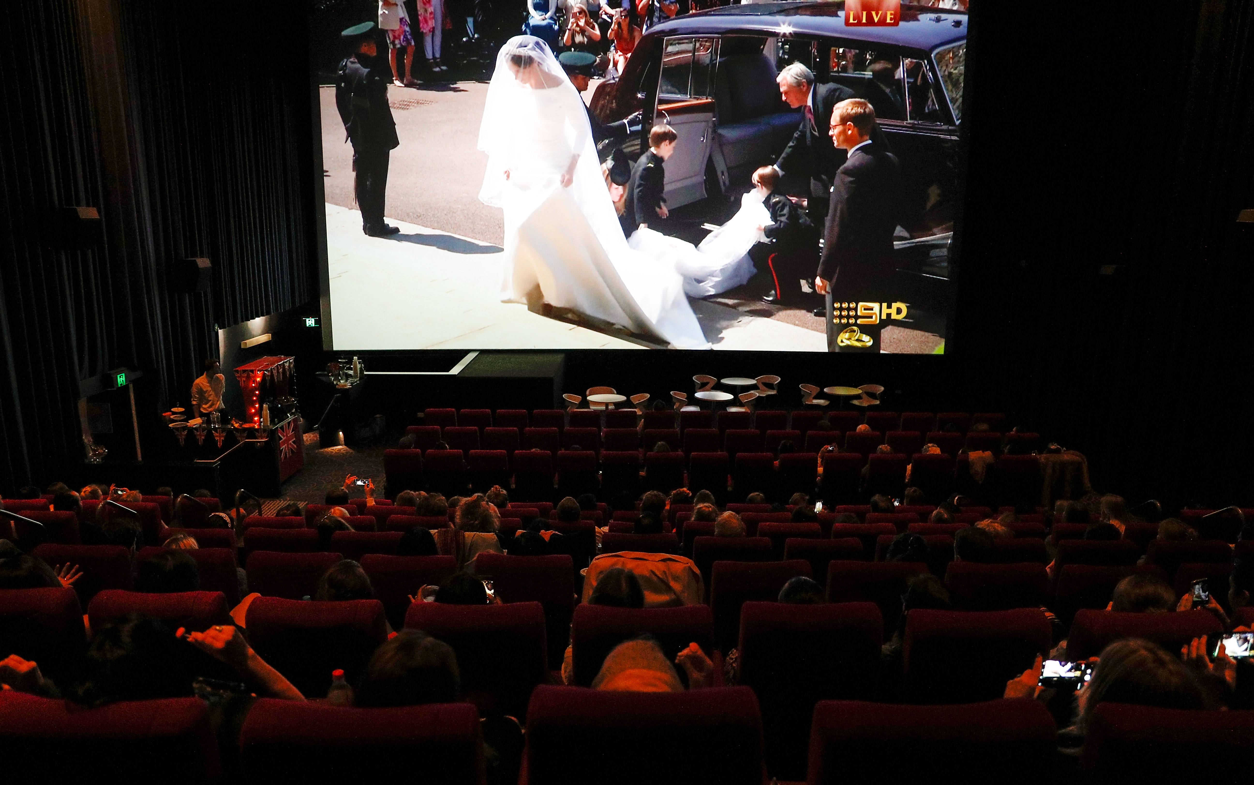 The royal wedding was broadcast live in cinemas across Australia, where audiences gathered to watch Meghan's arrival on giant screens. Australia's Nine Network carried the ceremony, allowing viewers thousands of miles from Windsor to follow the historic day in real time. | Source: Getty Images.