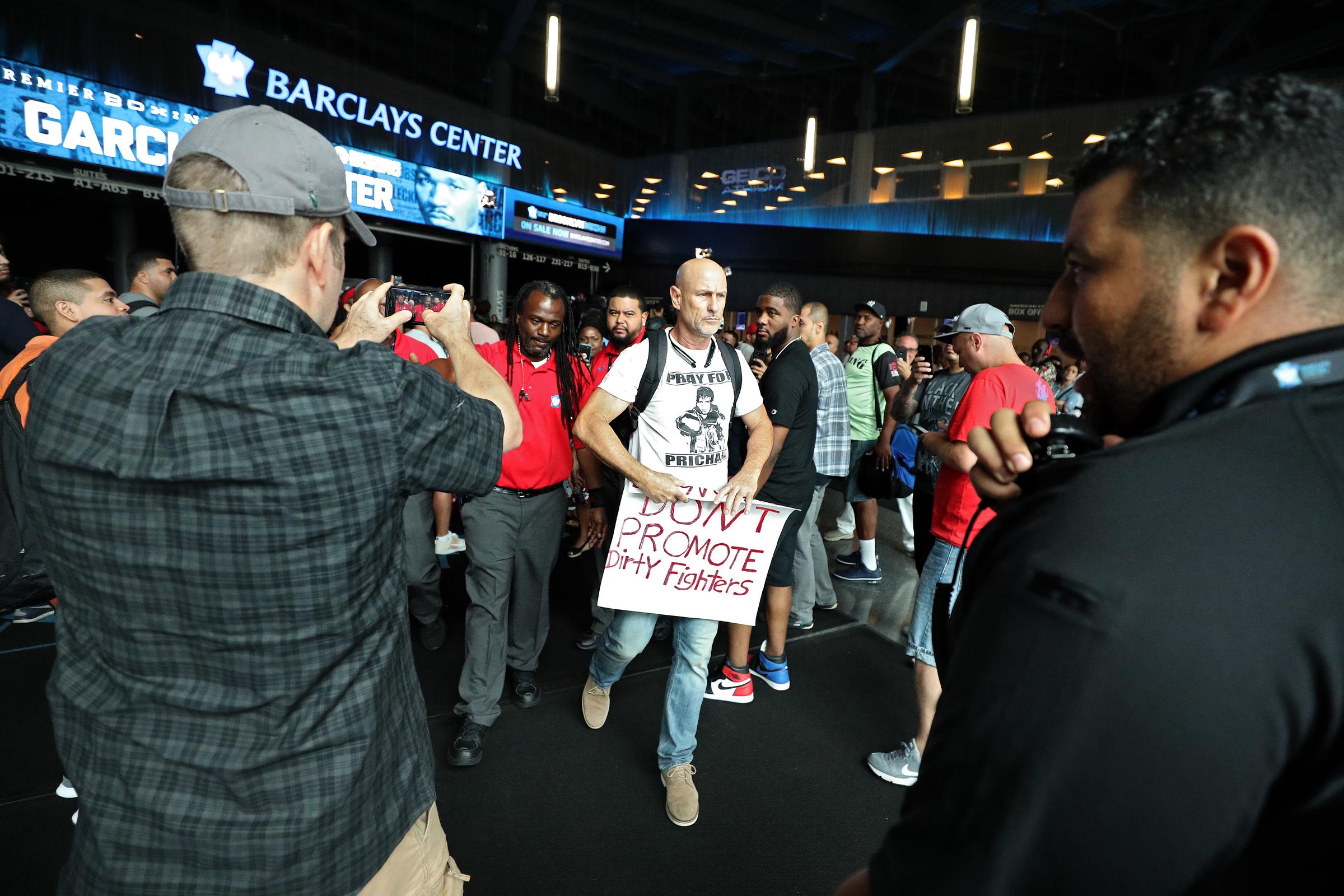Richard Colón protested at a Premier Boxing Champions weigh-in at Barclays Center in 2018, nearly three years after his son’s final fight. He carried a sign criticizing the promotion of fighters he believed had competed dangerously. | Source: Getty Images