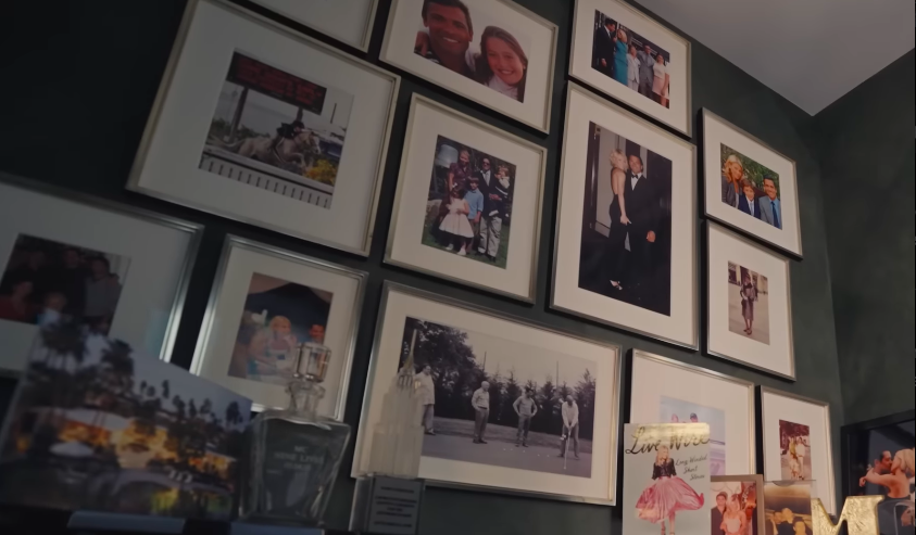 The gallery wall turns family memories into part of the decor. In a home filled with designer details, these personal photos help keep the space rooted in real life. | Source: YouTube/Architectural Digest