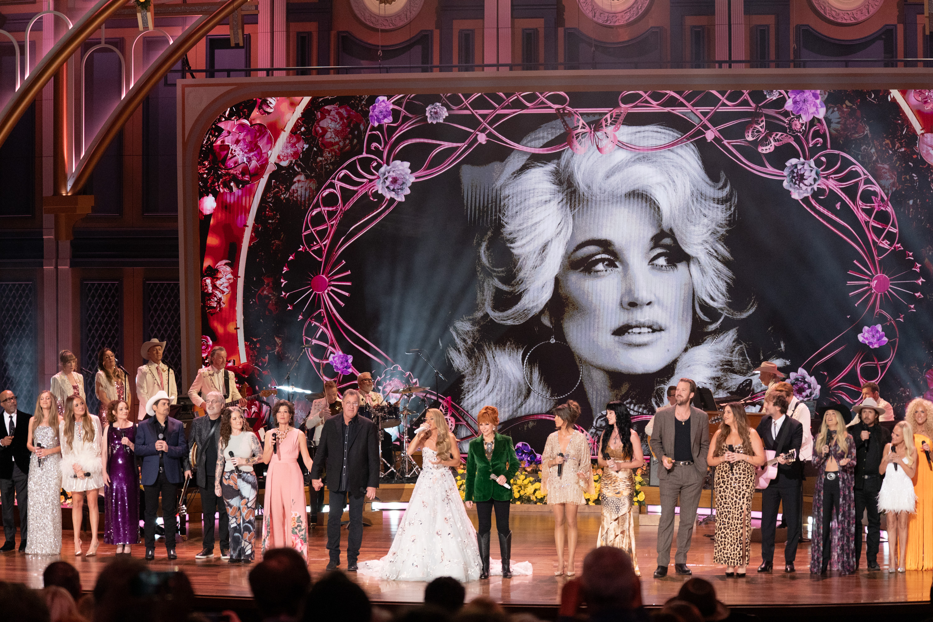 The pink wings behind Carrie were created through stage projections rather than attached to her performance outfit. | Source: Getty Images