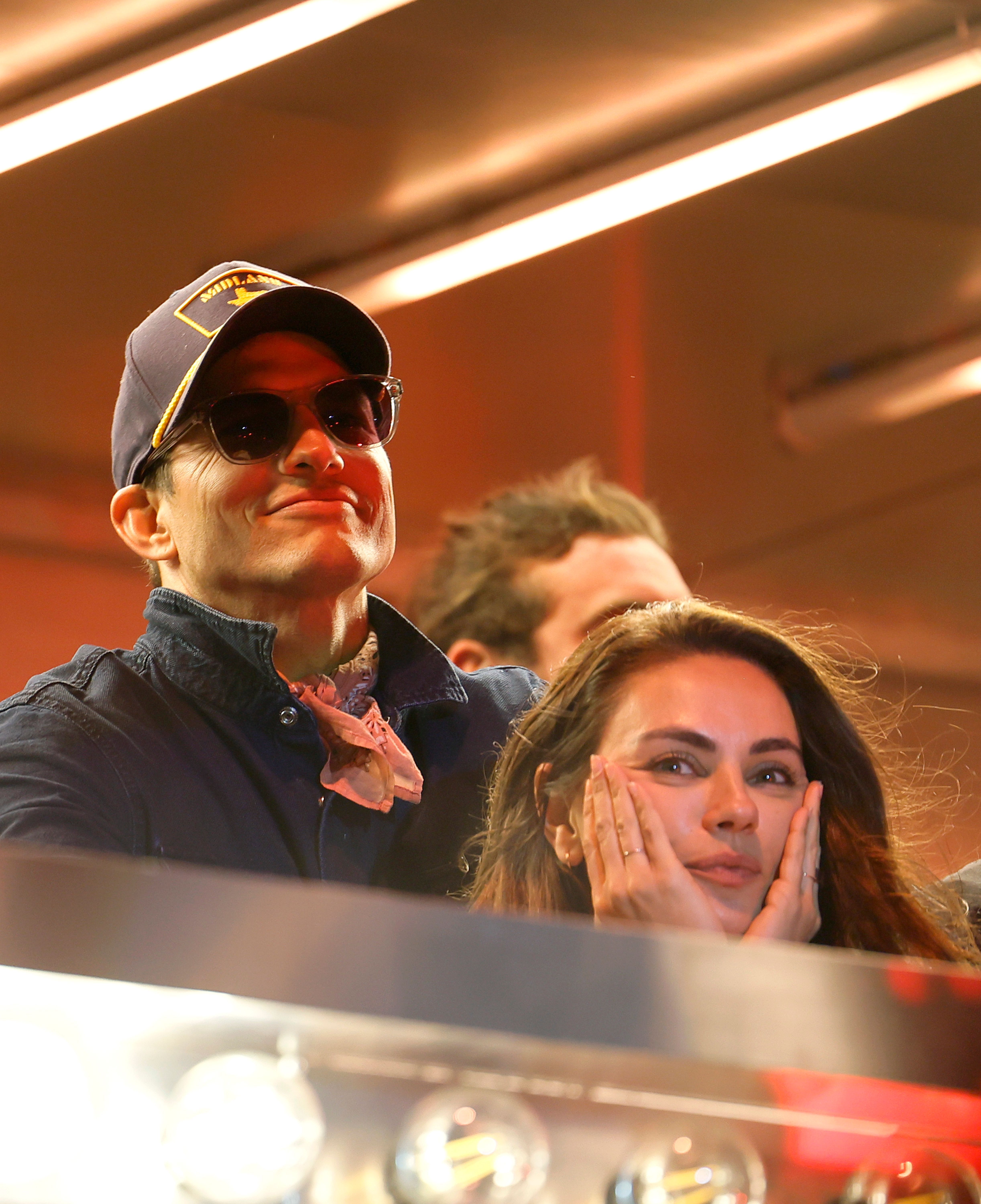 Ashton Kutcher and Mila Kunis are seen onstage with Midland at the T-Mobile Mane Stage during the 2025 Stagecoach Festival in Indio, California, on April 27. | Source: Getty Images