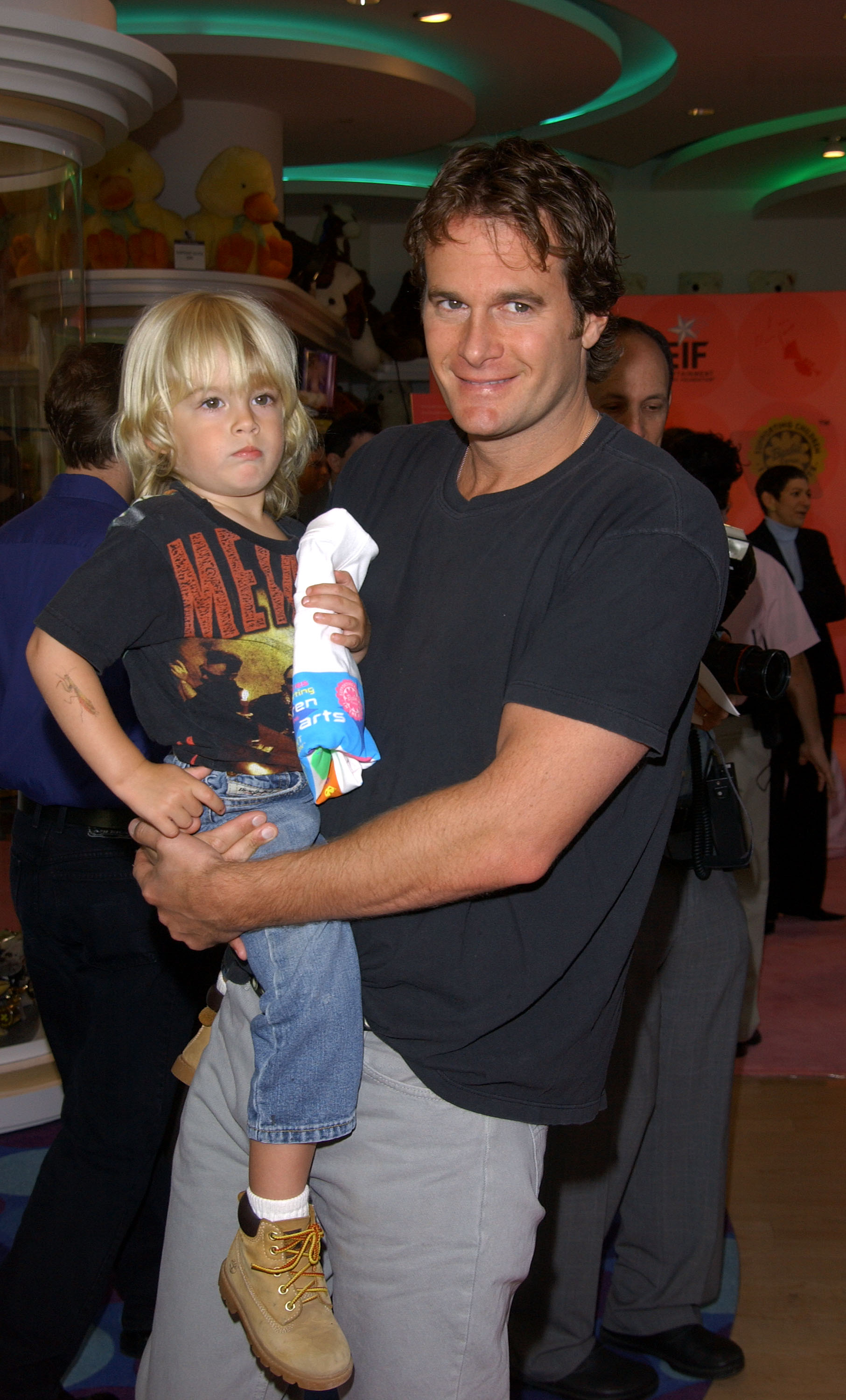 Entrepreneur Rande Gerber flashed a proud smile while carrying his young, blonde-haired son Presley Gerber at an Entertainment Industry Foundation charity event in Los Angeles, California, on April 13, 2002. | Source: Getty Images
