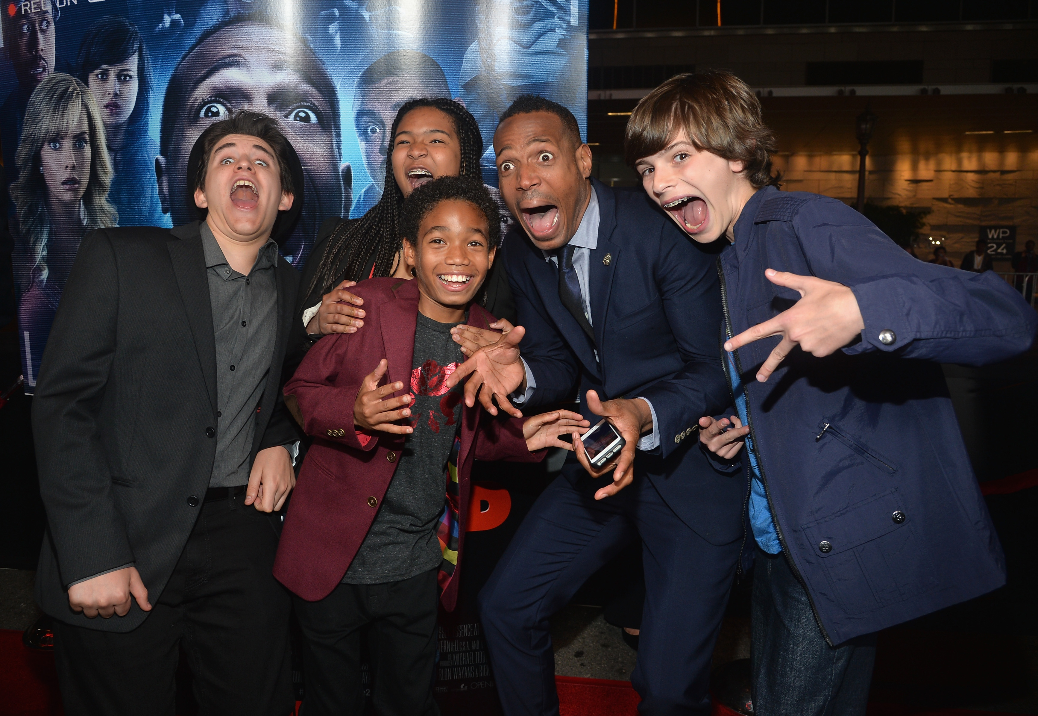 Marlon Wayans, Kai Wayans, and Shawn Howell Wayans arrive at the premiere of "A Haunted House 2" at Regal Cinemas L.A. Live on April 16, 2014, in Los Angeles, California | Source: Getty Images