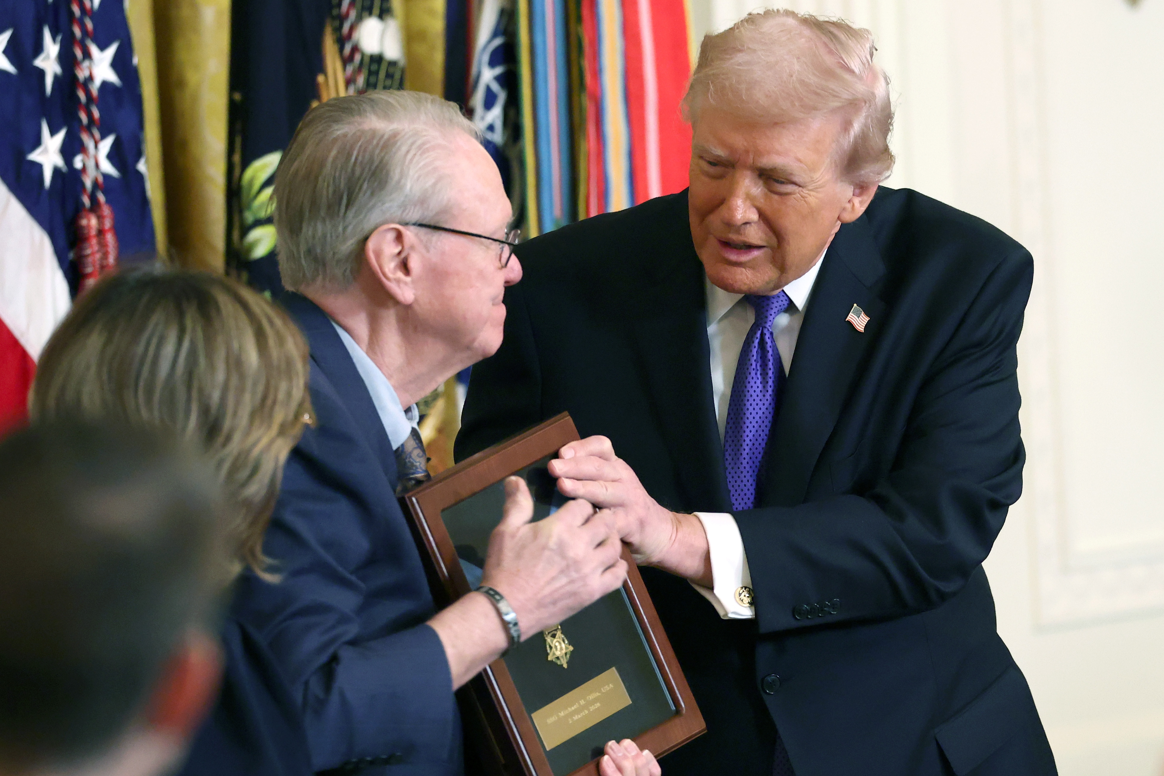 Linda Ollis and Robert Ollis accept the Medal of Honor on behalf of their son Staff Sergeant Michael H. Ollis from Donald Trump during a Medal of Honor Ceremony in the East Room of the White House on March 2, 2026, in Washington, DC | Source: Getty Images