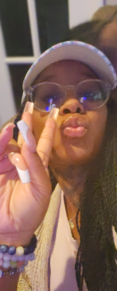 Brittany Members flashing the peace sign for a photo. | Source: GoFundMe/Honoring Brittany Members' Memory