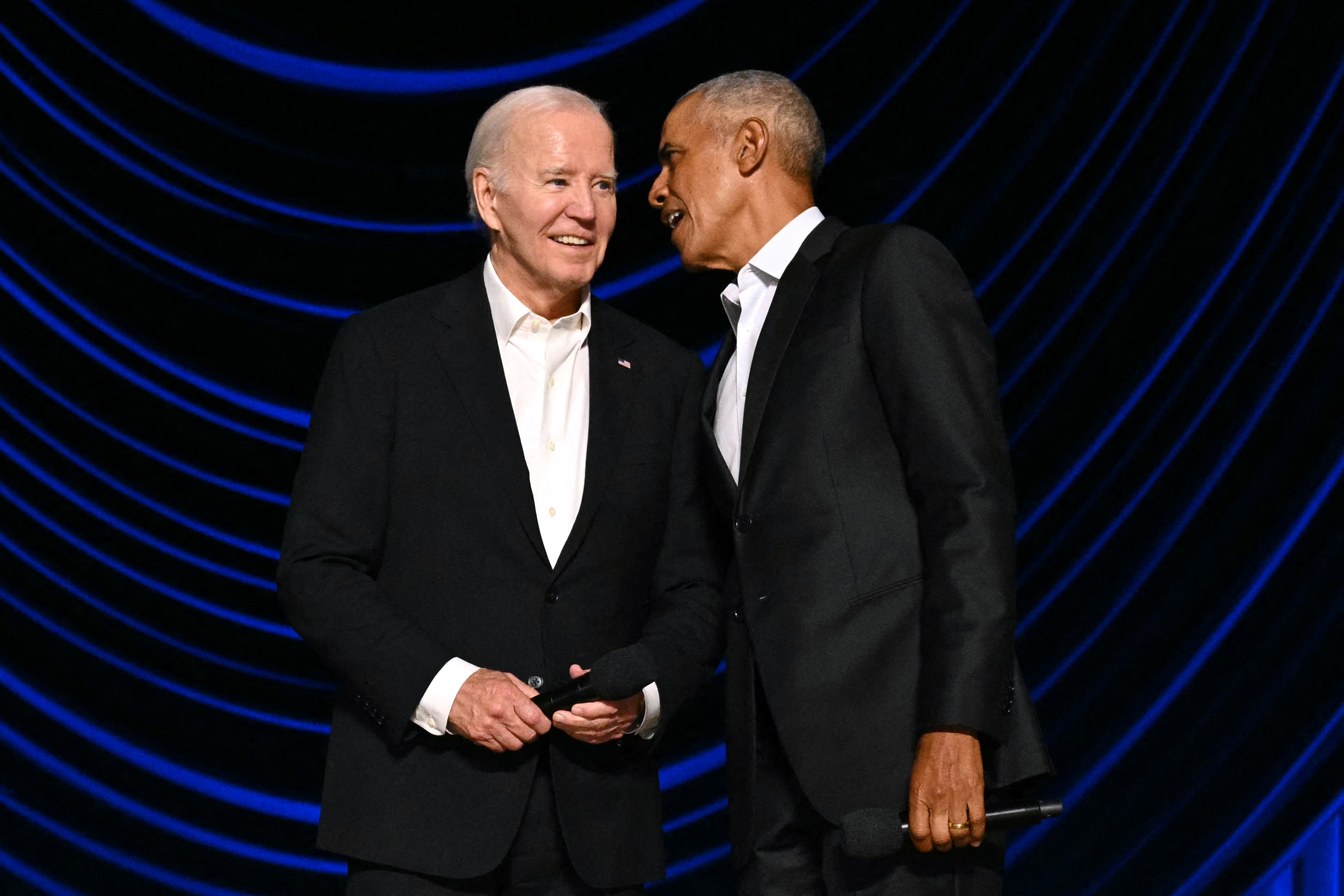 Joe Biden and Barack Obama are seen onstage during a campaign fundraiser at the Peacock Theater in Los Angeles on June 15, 2024 | Source: Getty Images