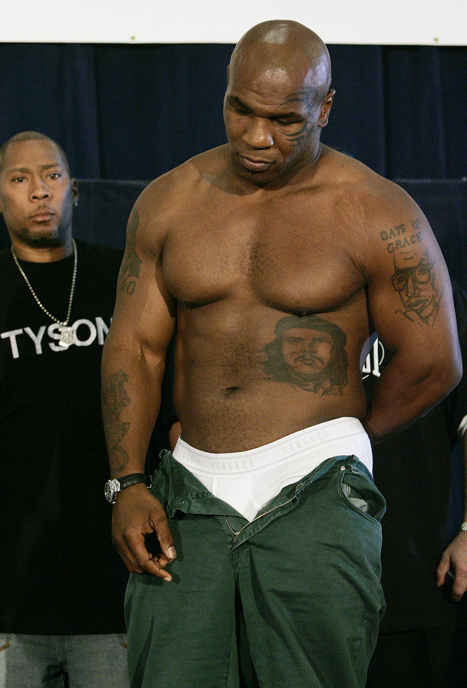 Mike Tyson waits to weigh in at the Blackburn Center at Howard University in Washington, D.C., on June 9, 2005. | Source: Getty Images