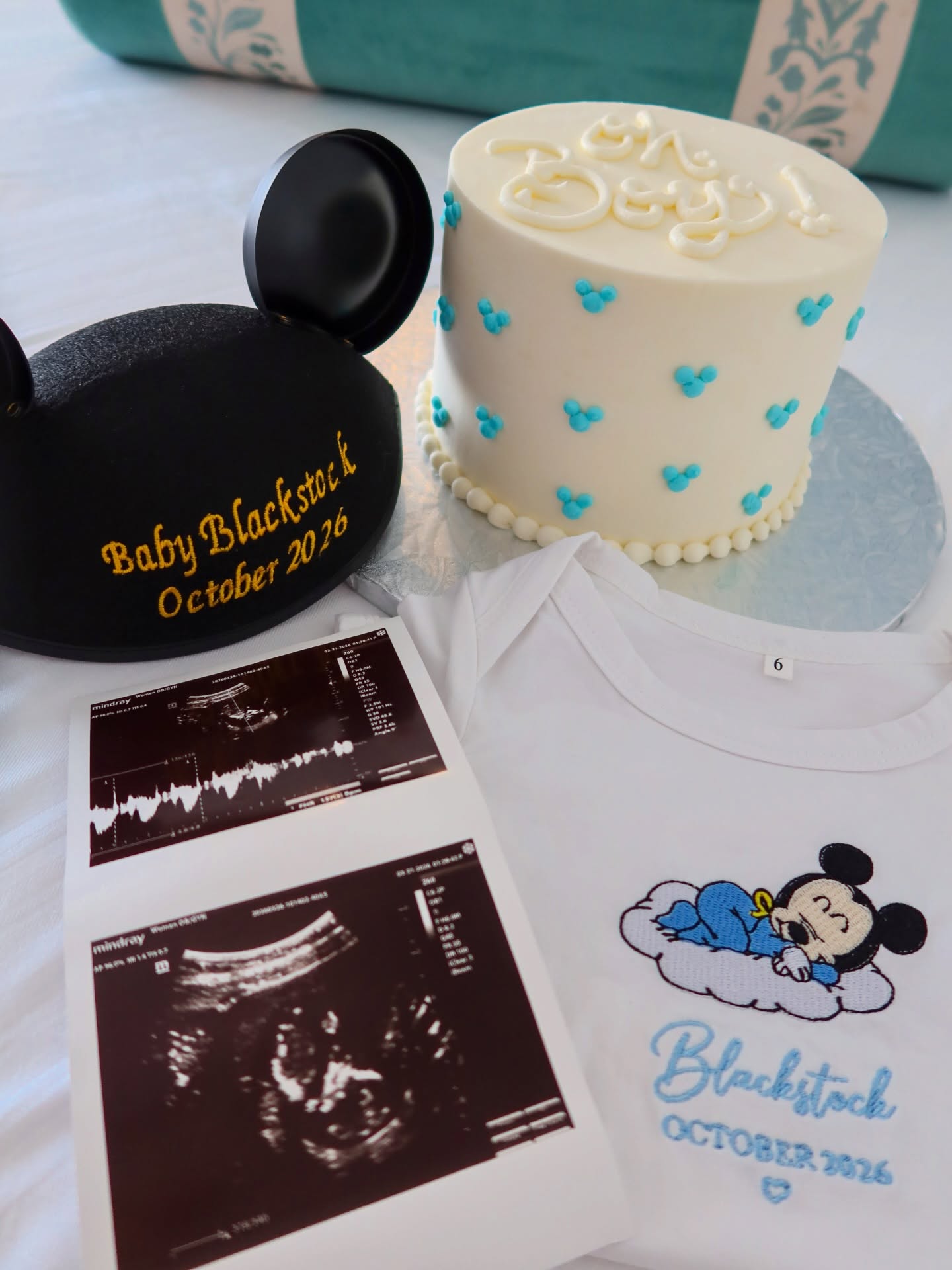 Sonogram photos, a "Baby Blackstock October 2026" Mickey Mouse hat, and a celebratory cake marked Shelby and Marissa Blackstock's pregnancy announcement. | Source: Instagram/rissablackstock