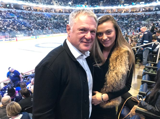 Claude Lemieux poses with his daughter, Claudia Lemieux, at an NHL game as they traveled to support Brendan Lemieux during his NHL debut. | Source: X/Winnipeg Jets
