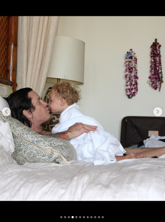Ozzy Osbourne plays with his grandchild, from a post dated July 24, 2025 | Source: Instagram/lisastelly