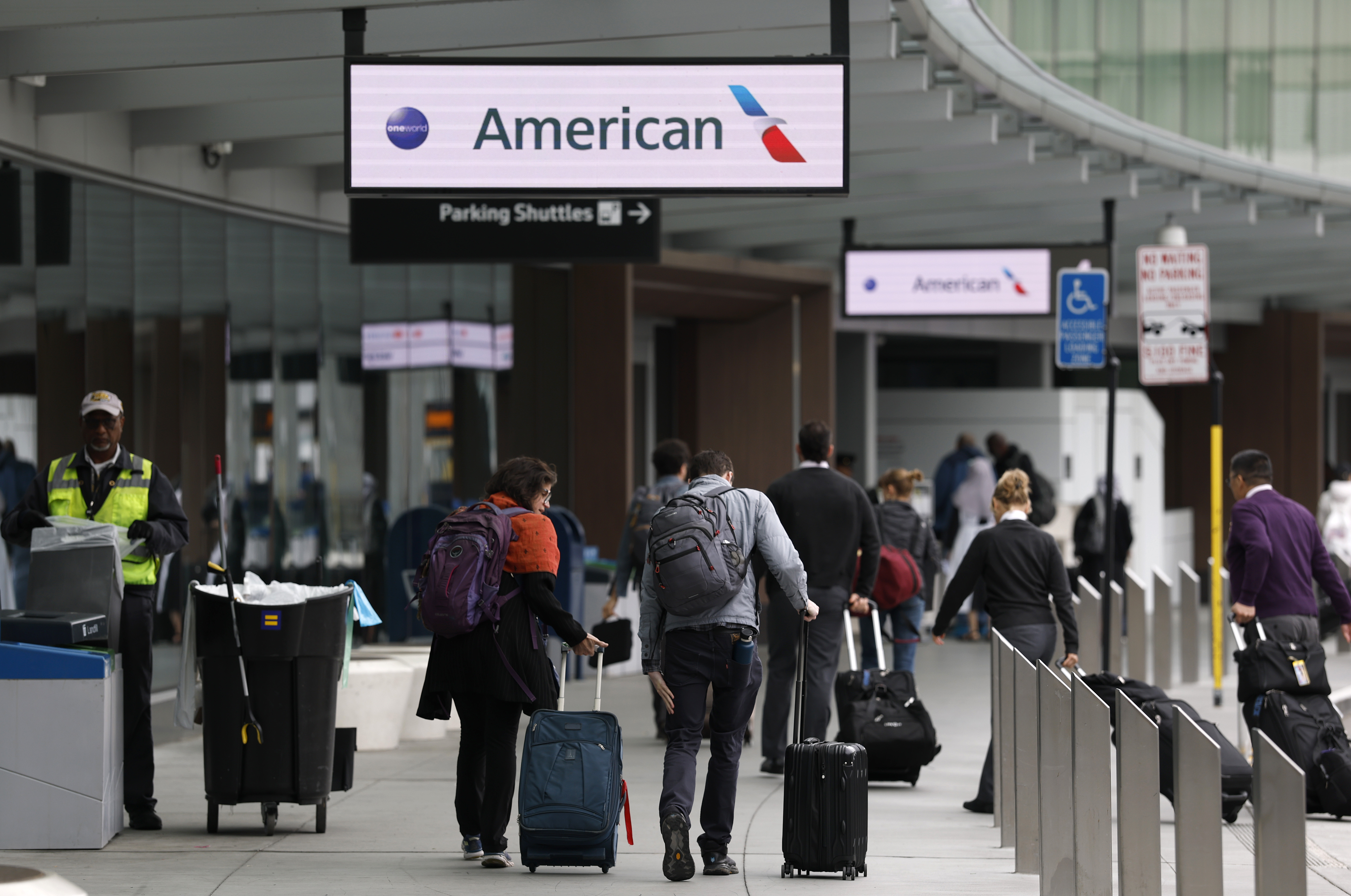 Travelers arrive at San Francisco International Airport on April 24, 2025. | Source: Getty Images