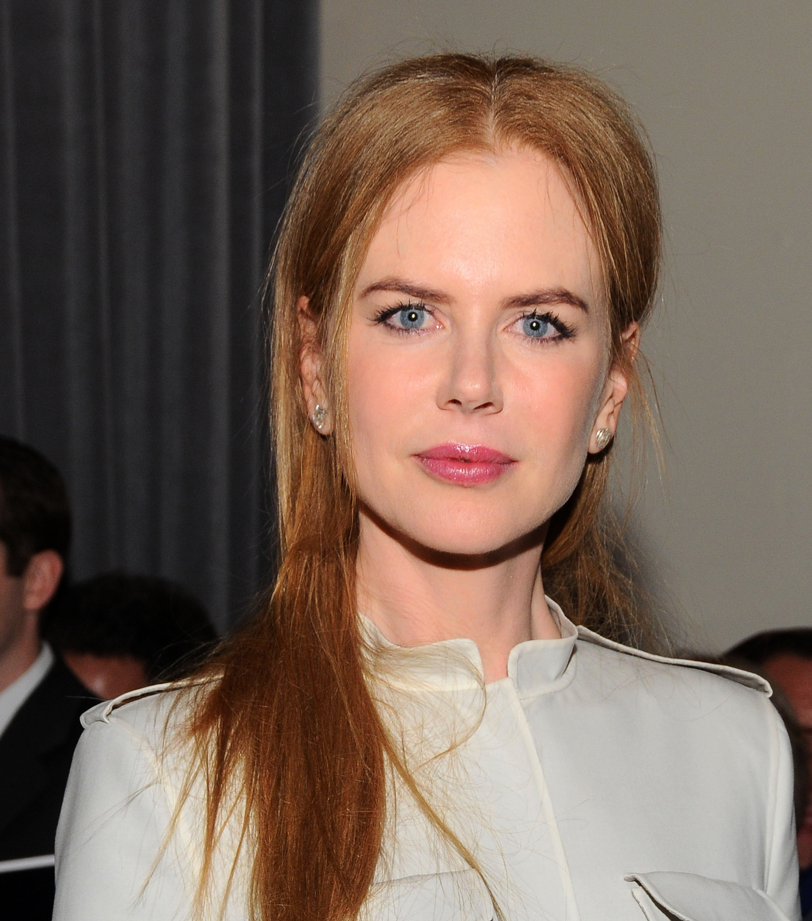 A gathered low hairstyle and a structured, high-necked white jacket defined her look at the Family Violence Prevention Fund ceremony on January 8, 2010. Her immaculately smooth forehead and full, line-free complexion continued to fuel the public debate surrounding cosmetic enhancements. | Source: Getty Images