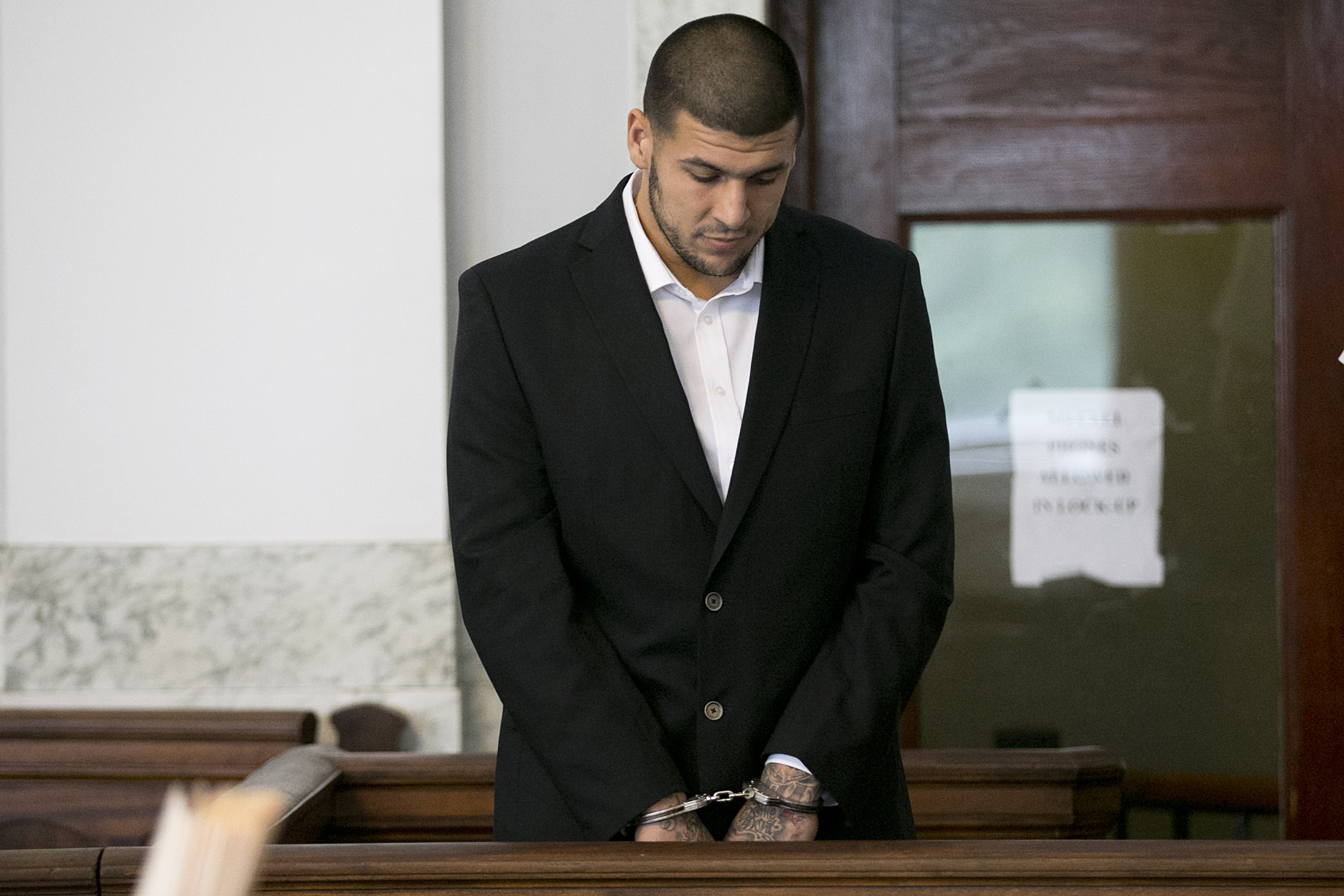 Aaron Hernandez inside the courtroom of the Attleboro District Court in North Attleboro, Massachusetts, for his hearing on August 22, 2013. | Source: Getty Images