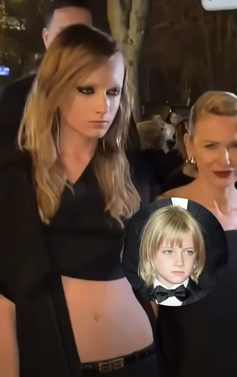 Kai Schreiber keeps a focused expression as she walks ahead, while Naomi Watts smiles softly beside her. The pair share a brief moment mid-step as they move together through the night. | Source: Facebook/IWMBuzz