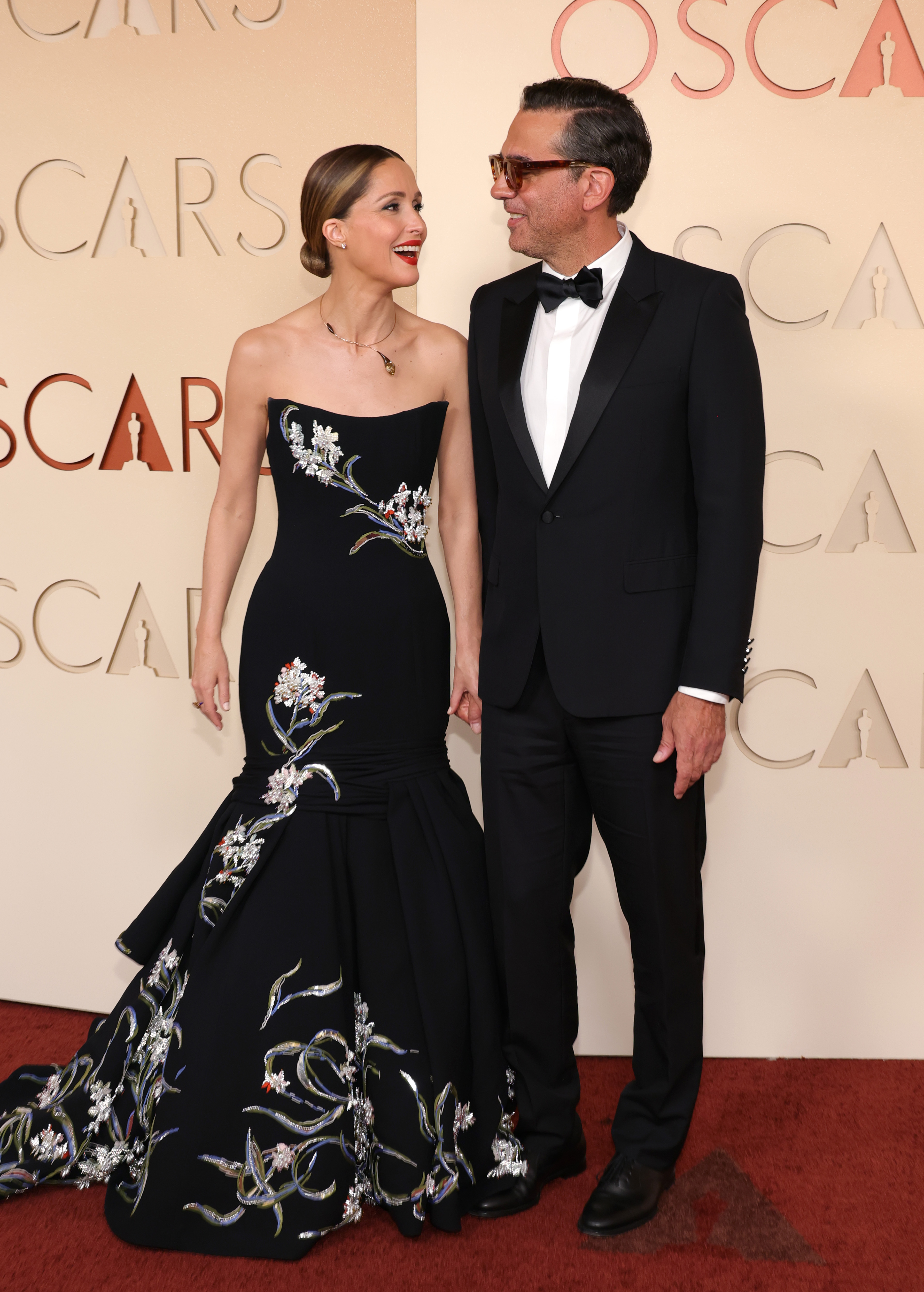 Rose Byrne and Bobby Cannavale share a warm moment on the red carpet at the 98th Oscars at the Dolby Theater on March 15, 2026. | Source: Getty Images