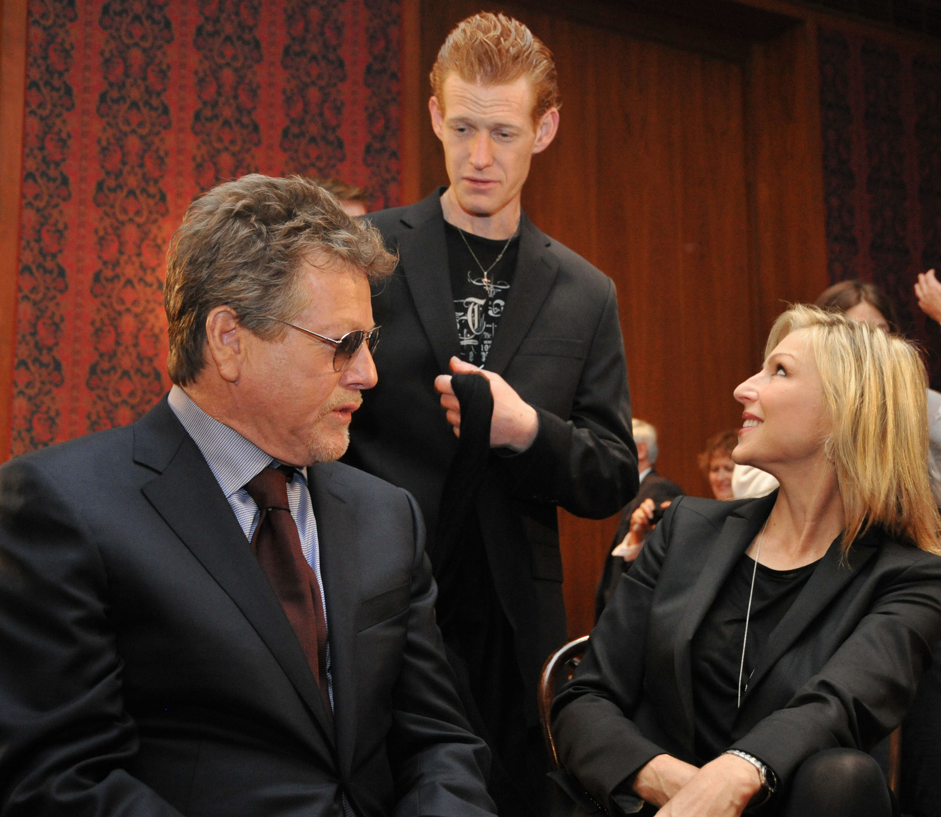 Actor Ryan O'Neal, his son Redmond, and his daughter Tatum following a ceremony in which items belonging to the late actress Farah Fawcett were enshrined in the Smithsonian Institution's National Museum of American History, on February 2, 2011, in Washington, DC. | Source: Getty Images