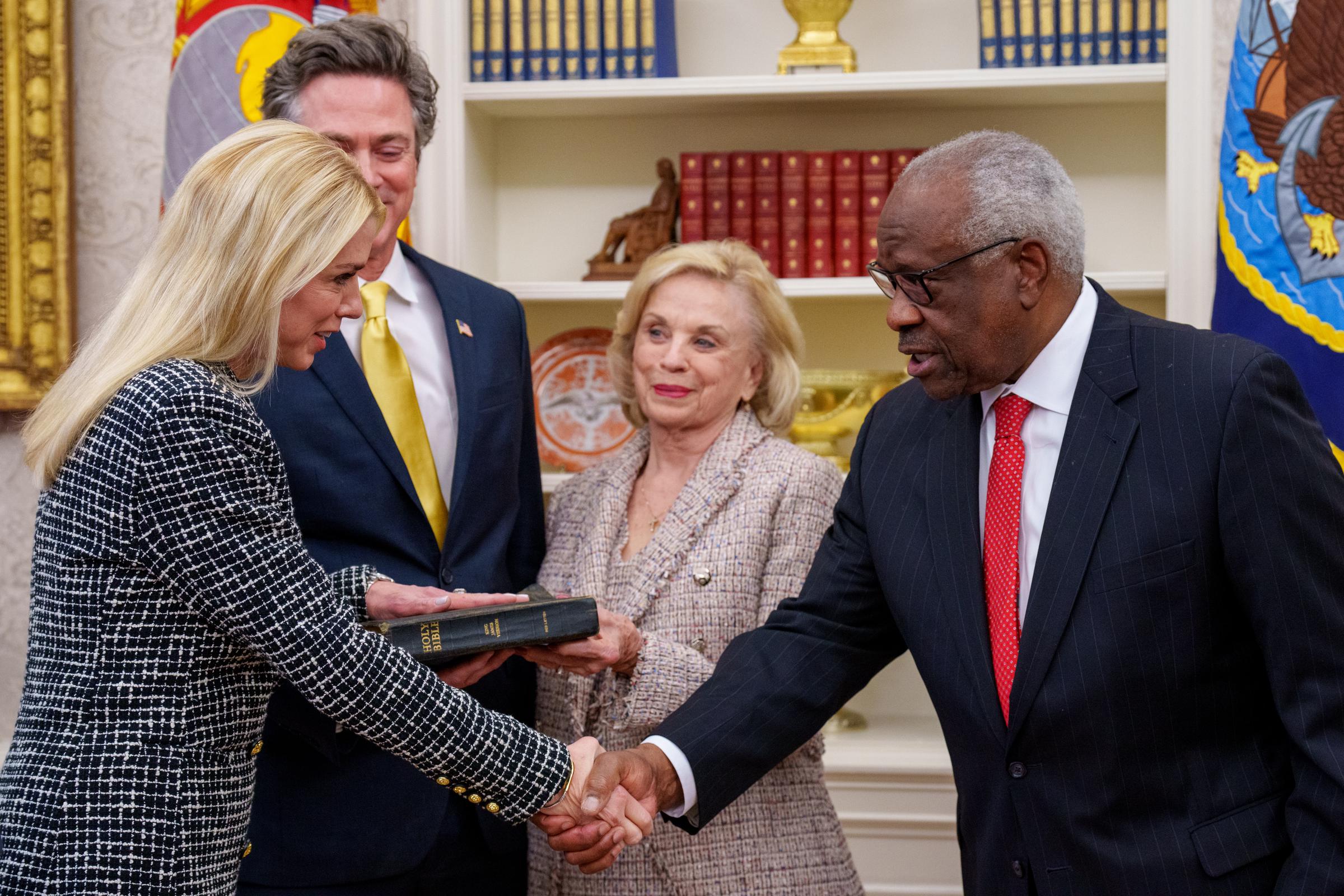 Pam Bondi is sworn in as U.S. Attorney General on February 5, 2025, as her longtime partner and her mother, Patsy Bondi, stand behind her in the Oval Office | Source: Getty Images