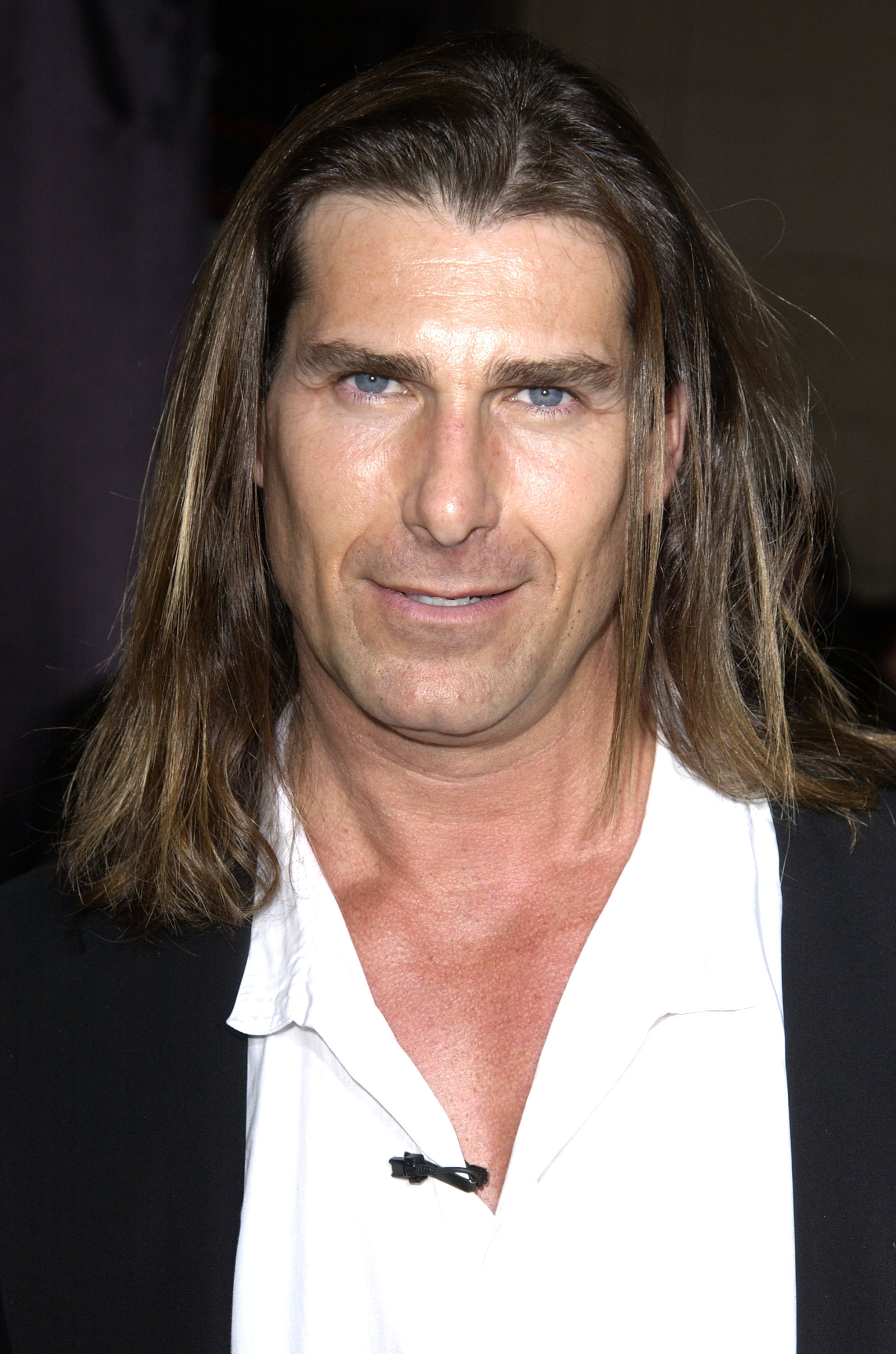 Over the years, he only became more handsome and in high demand among women. In this photo, he attended the premiere of "Shanghai Knights" in Hollywood, California, on February 3, 2003. | Source: Getty Images