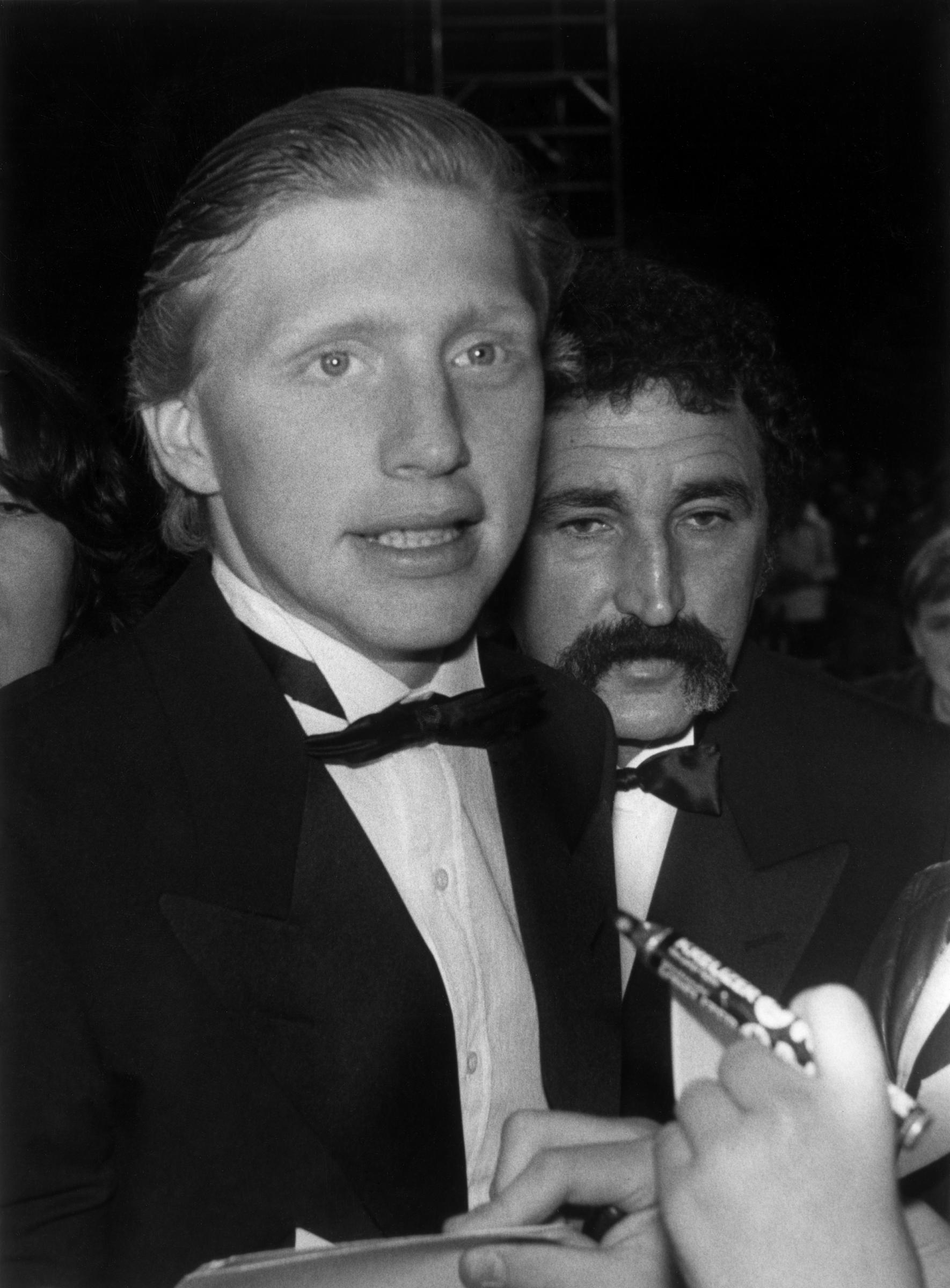 A young Boris Becker faced reporters in an undated photograph from the earlier years of his tennis career, long before his private life became a regular source of headlines. The German star had shot to global fame as a teenager, becoming the youngest Wimbledon men's singles champion at 17 in 1985 before going on to collect six Grand Slam singles titles.
