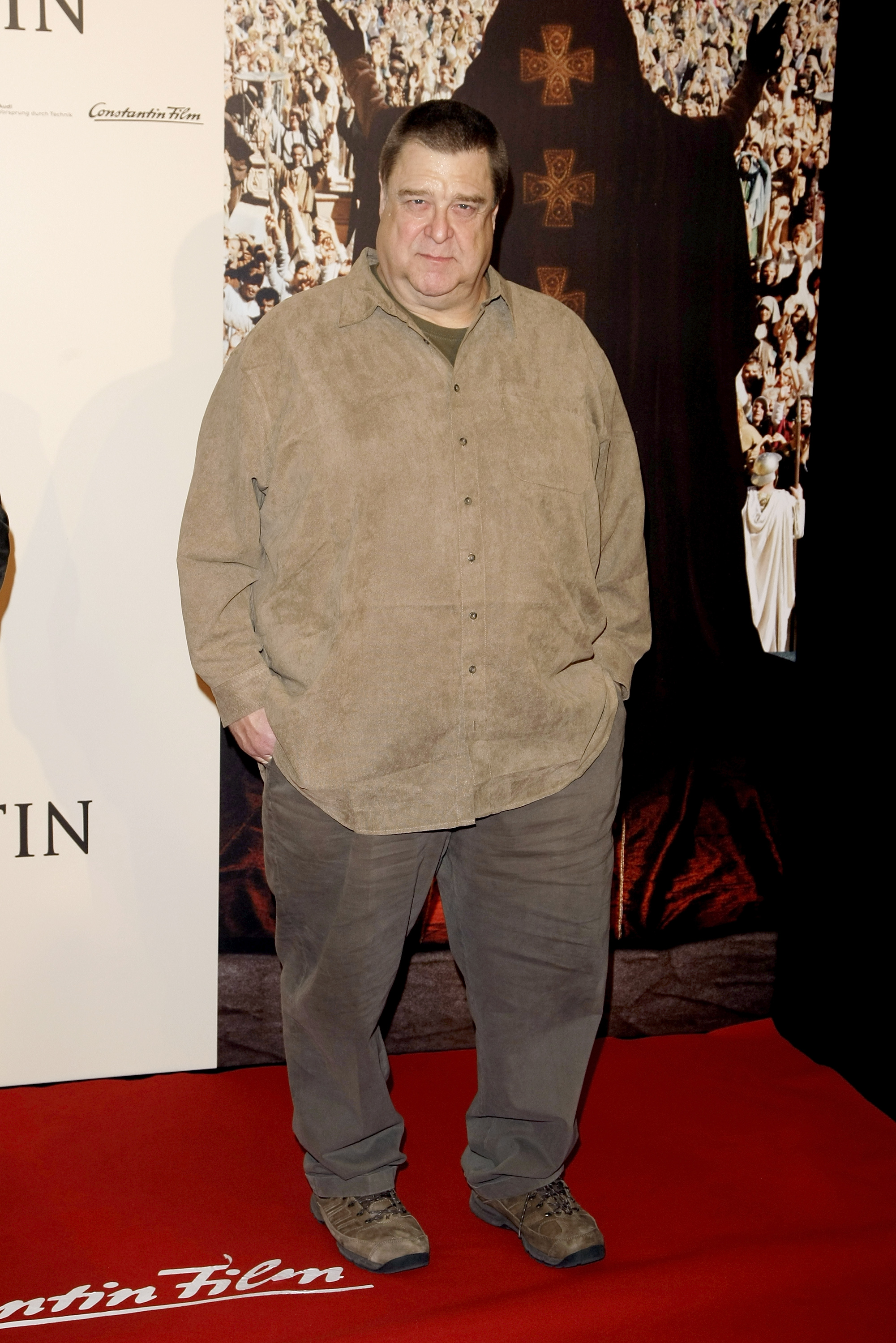 Goodman sported a shirt over a trouser in brown shade. The actor posed with both hands in the pockets of the trousers at the photocall of "Pope Joan" at Hotel Ritz Carlton on October 19, 2009 in Berlin, Germany.