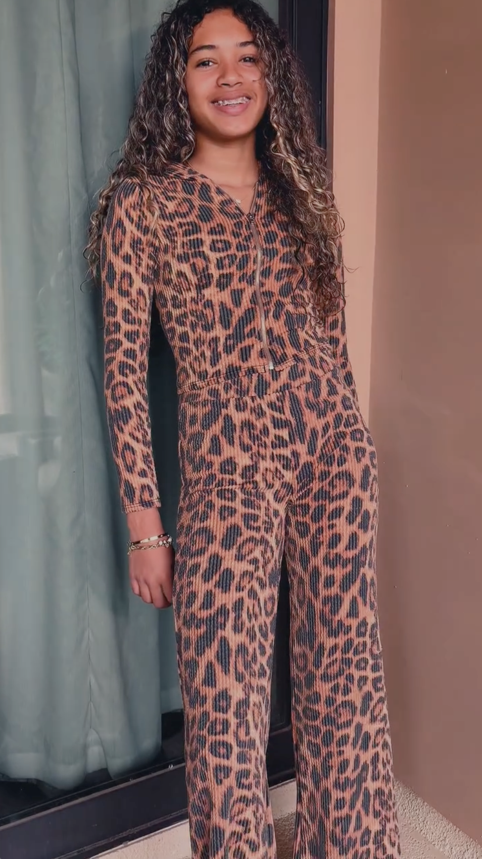 Royalty Brown smiles for the camera, pairing the statement look with a relaxed pose | Source: Instagram/missroyaltybrown