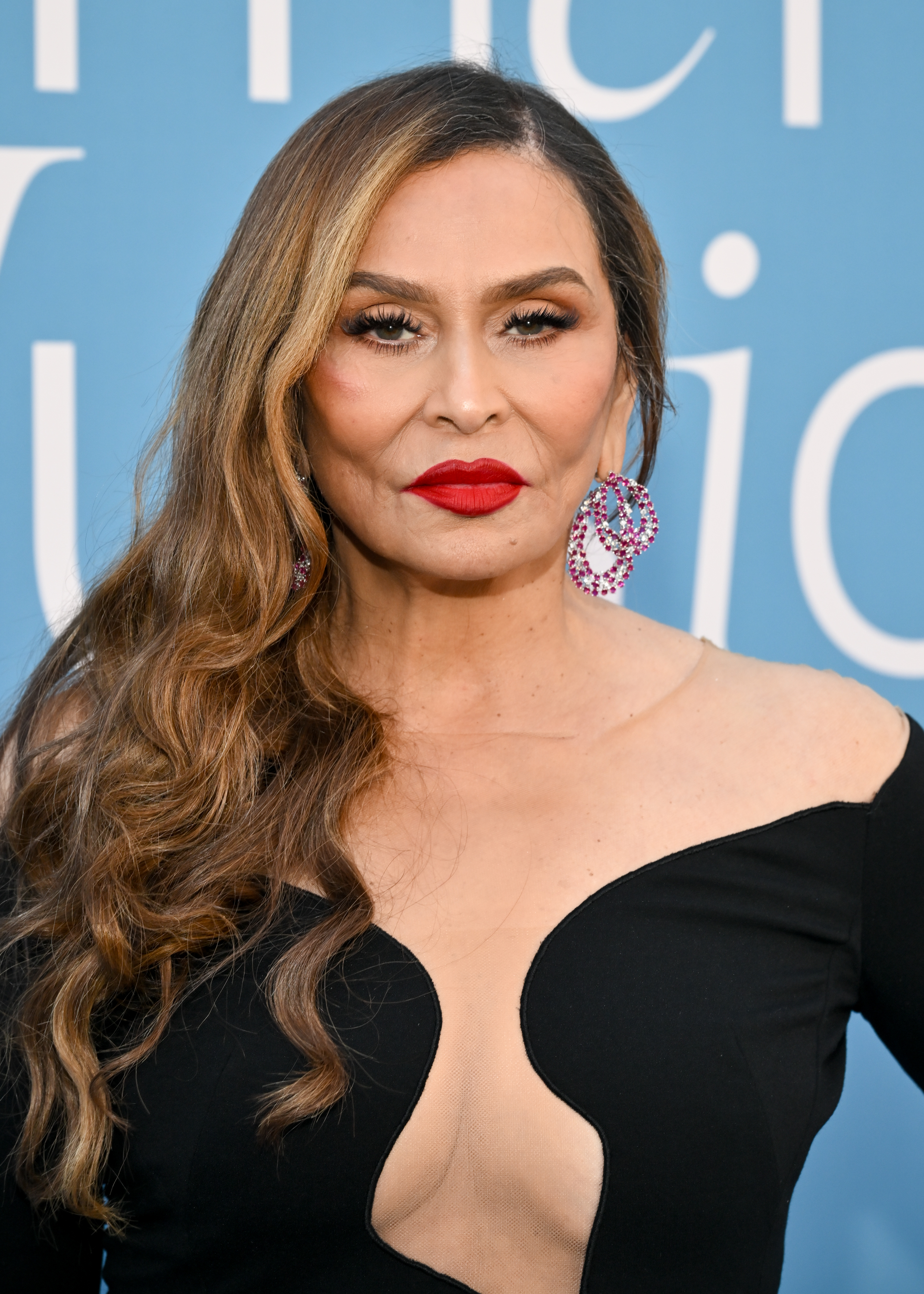 Tina Knowles, who has spent decades helping shape Beyoncé's glamorous image, has her own beauty routine — but it was her granddaughter Blue Ivy who recently introduced her to a new eyebrow trick. | Source: Getty Images