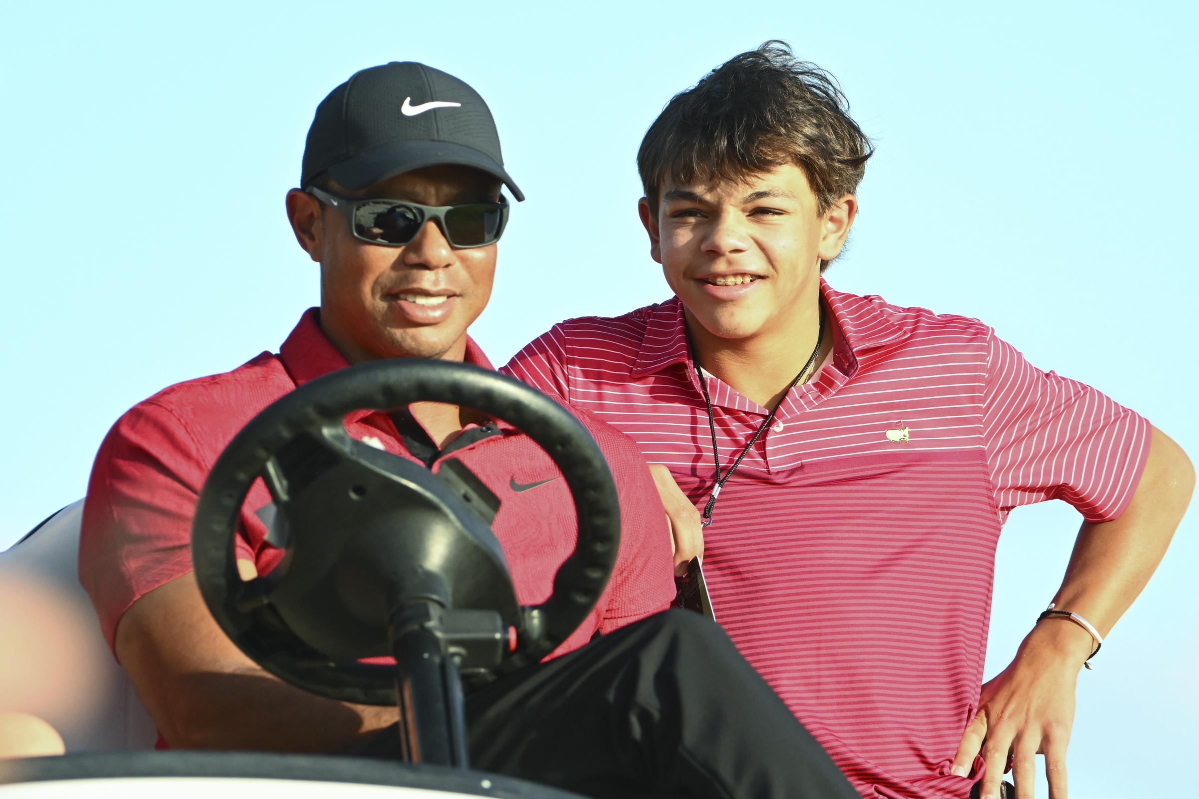 Tiger Woods and Charlie Woods watch Justin Thomas during the final round of the Hero World Challenge at Albany on December 4, 2022, in Nassau, Bahamas | Source: Getty Images